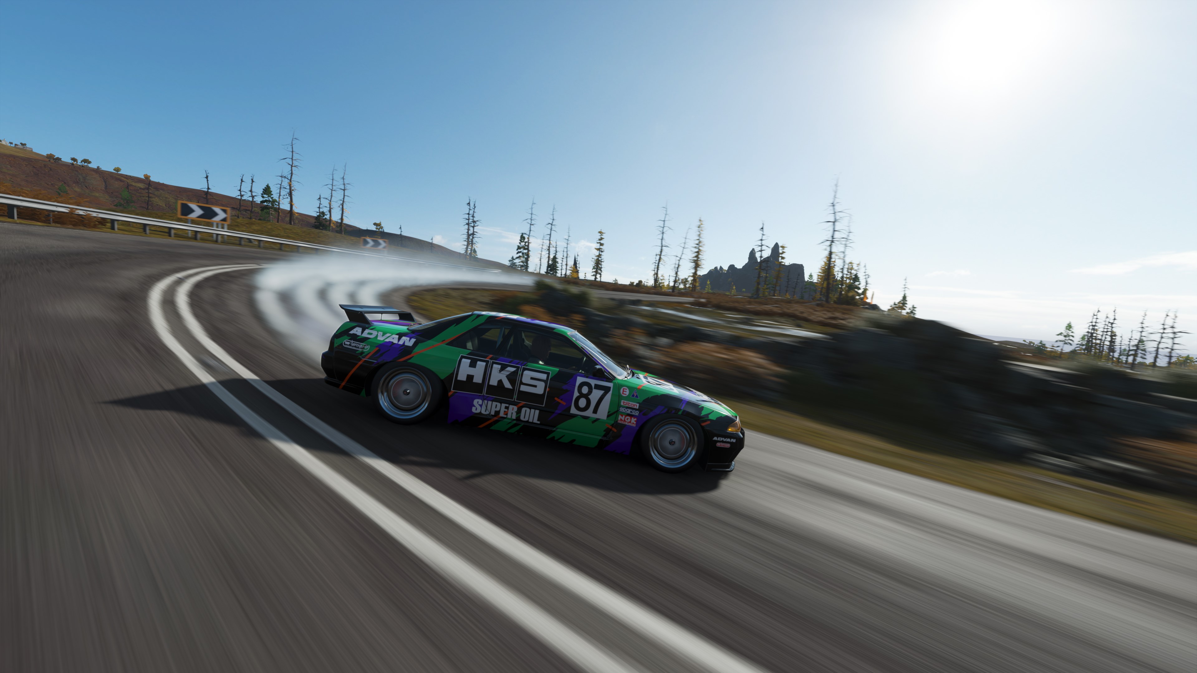 Nissan Skyline R32 drifting on a mountain road HD Wallpaper