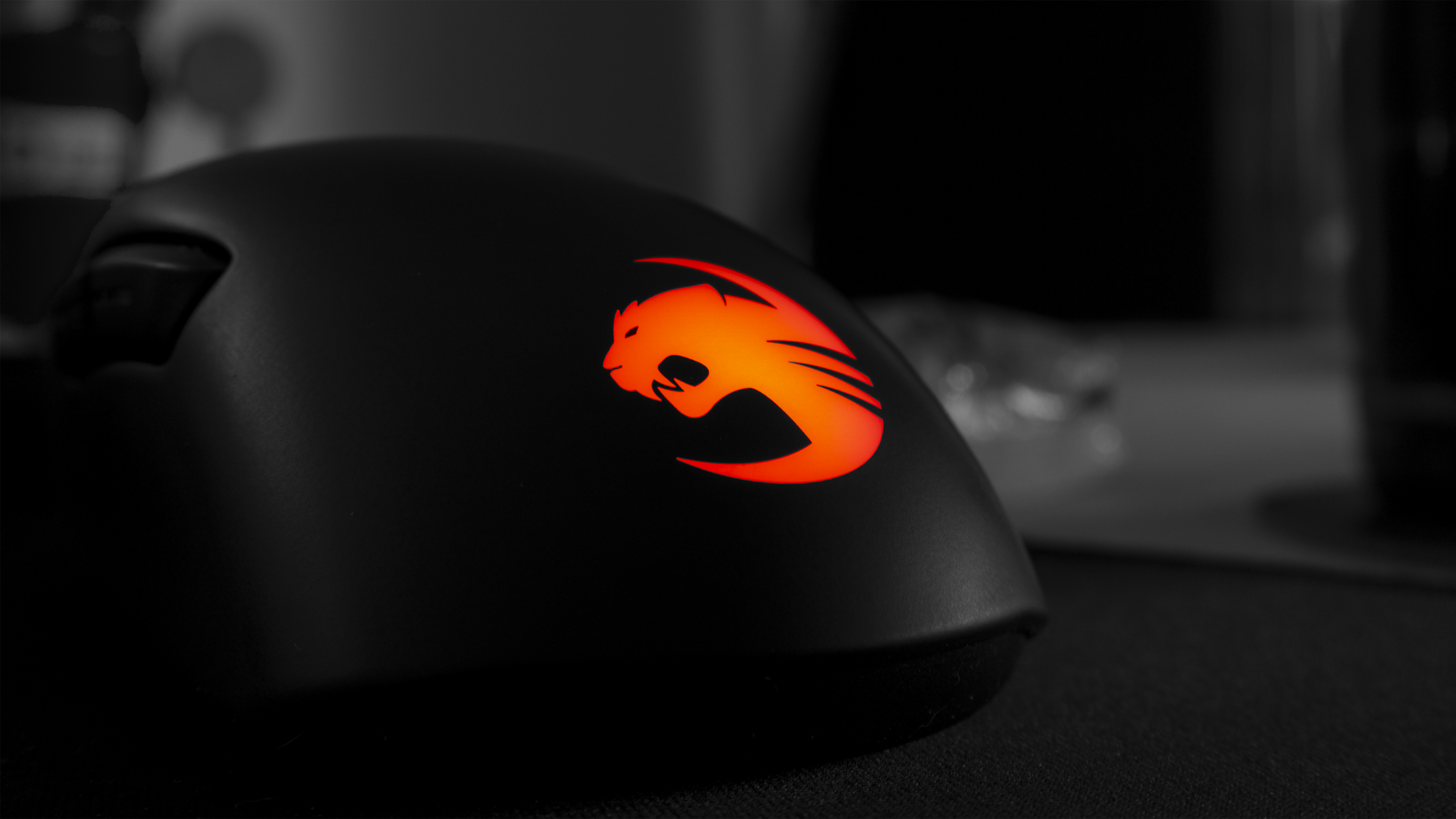 Roccat computer mouse with illuminated logo HD Wallpaper