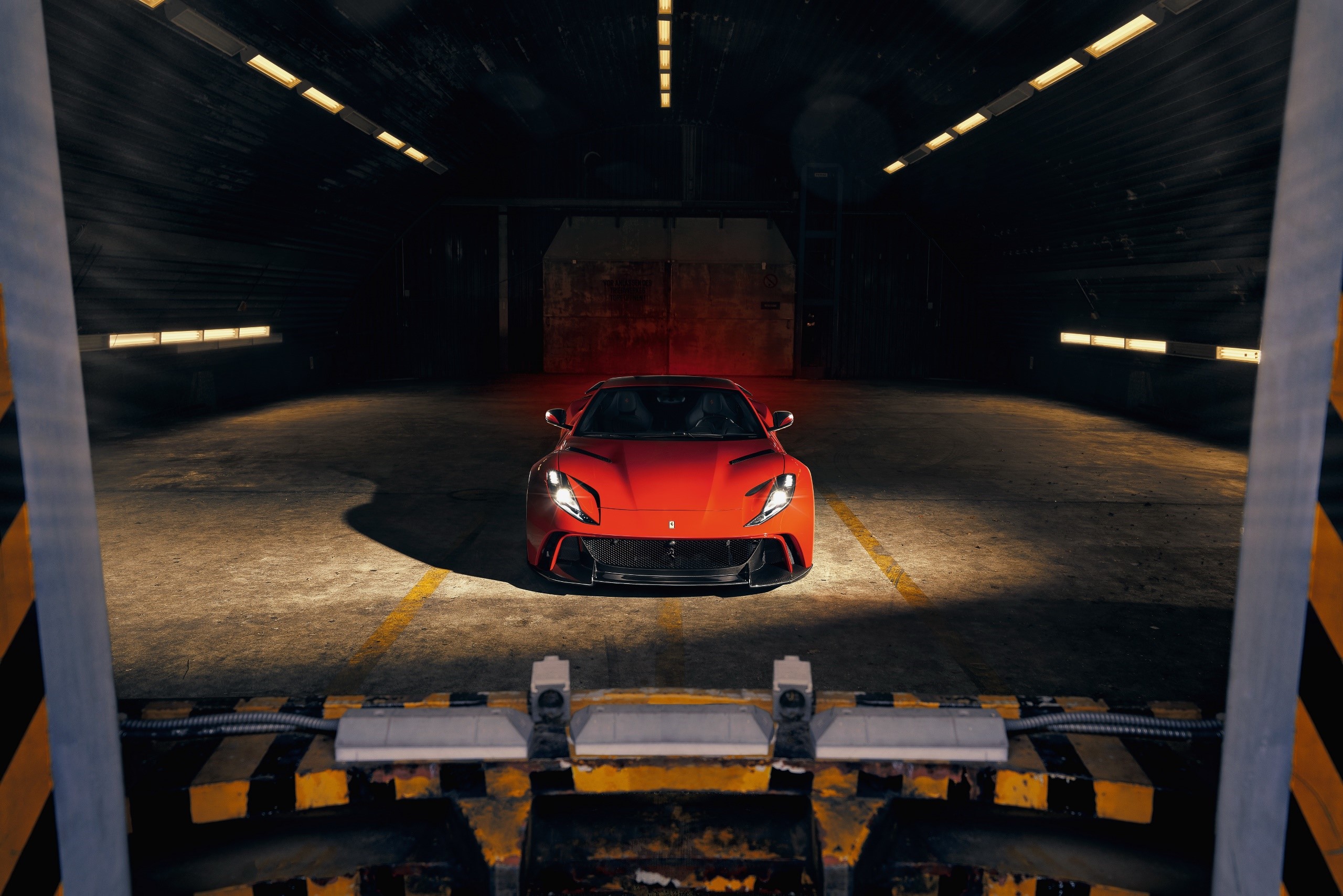 Red Ferrari 812 Superfast parked in a dark garage HD Wallpaper