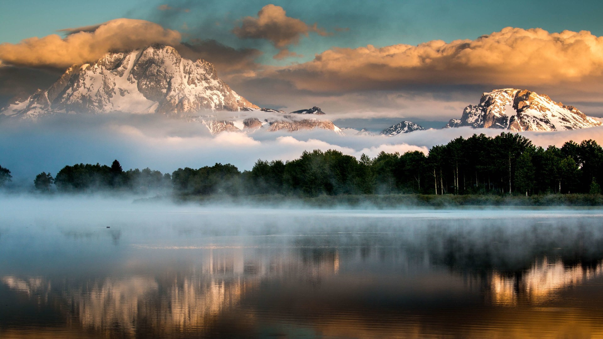 Mountains over a misty lake in Grand Teton National Park HD Wallpaper