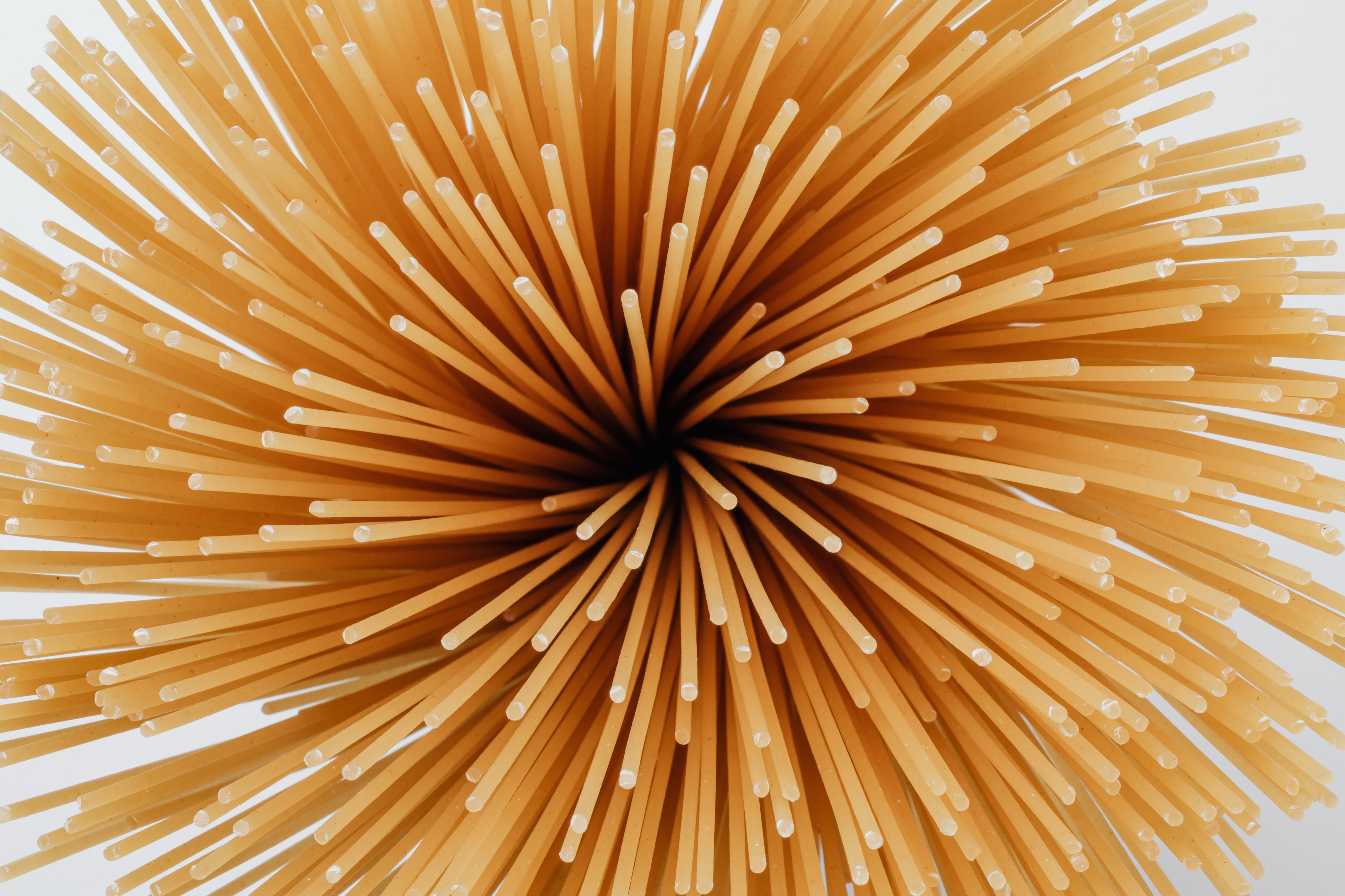 Close-up of uncooked spaghetti pasta HD Wallpaper