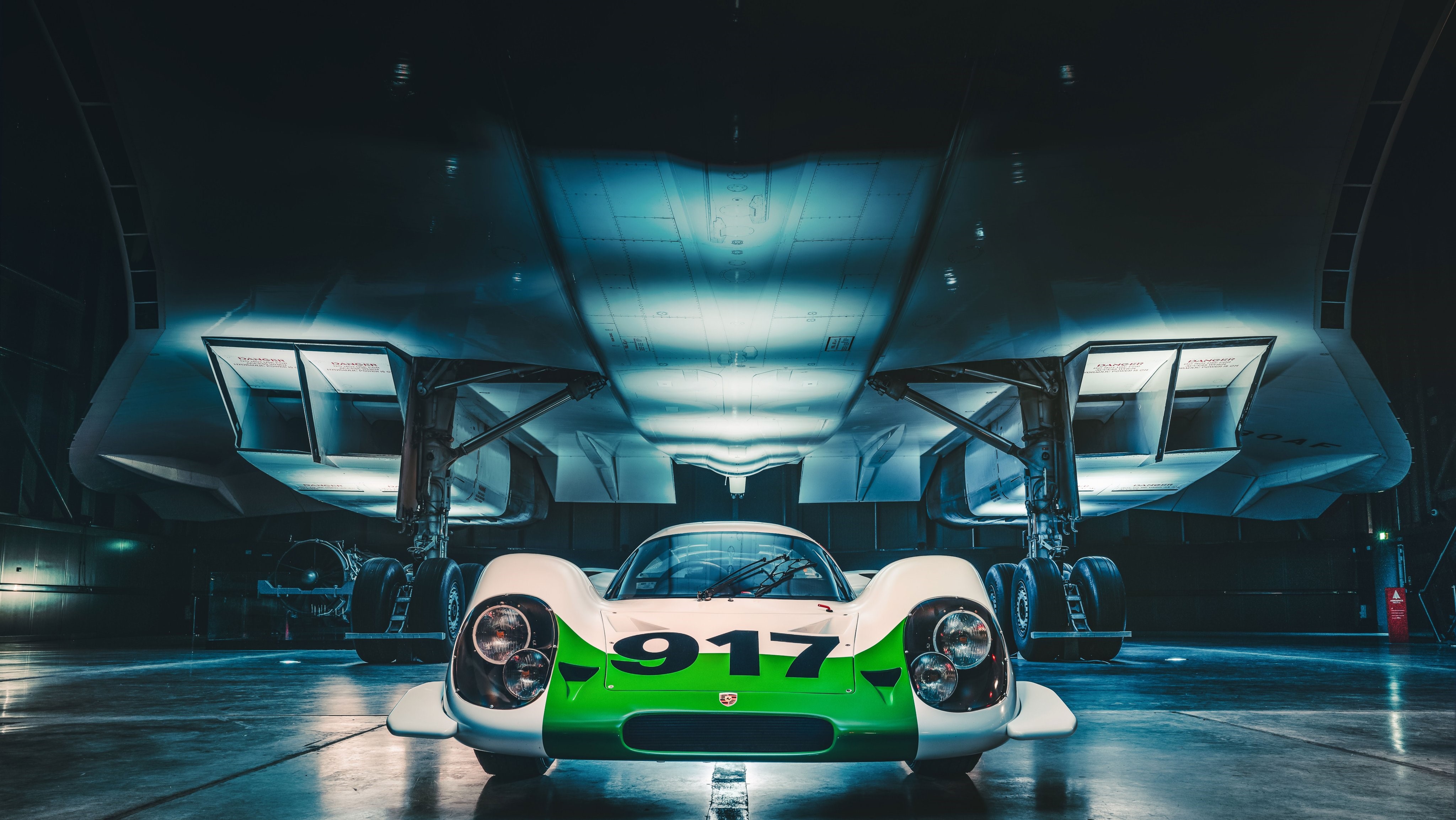 Porsche 917-001 and Concorde in hangar HD Wallpaper