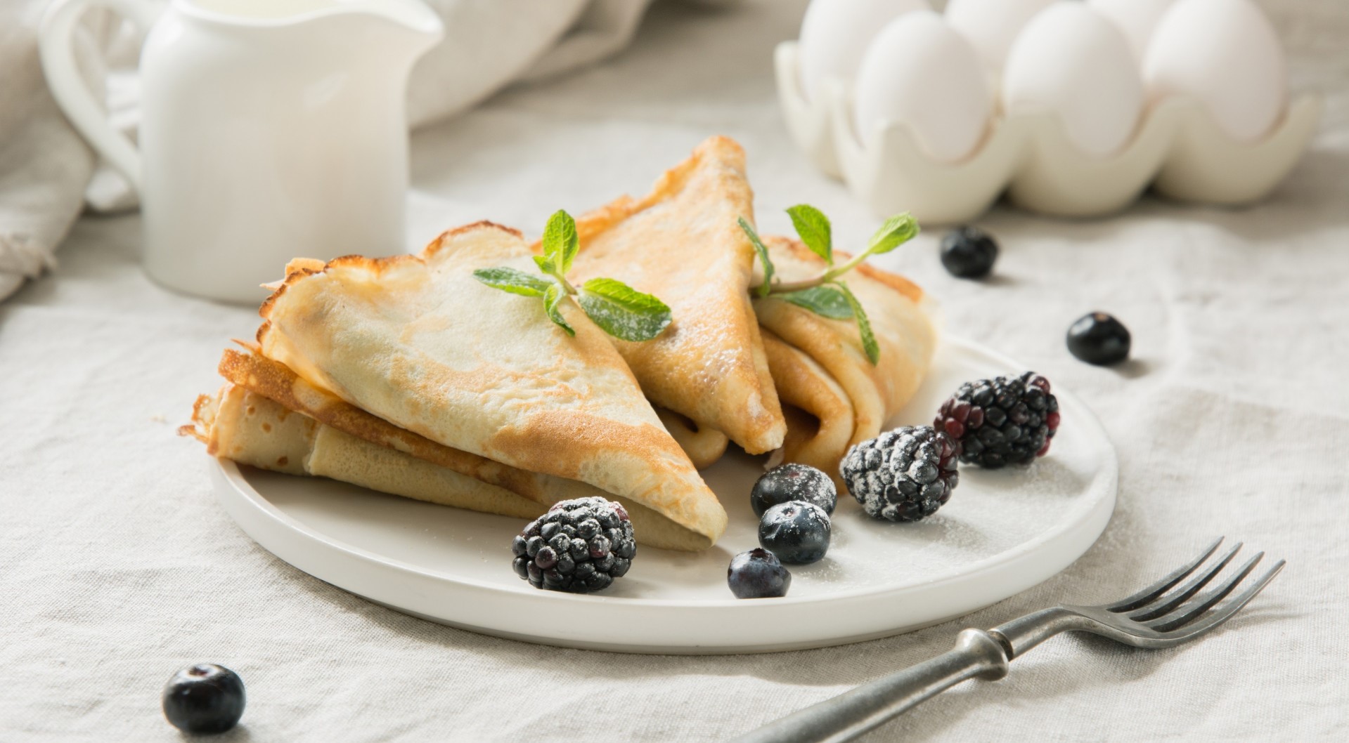 Pancakes with berries and mint on a plate HD Wallpaper