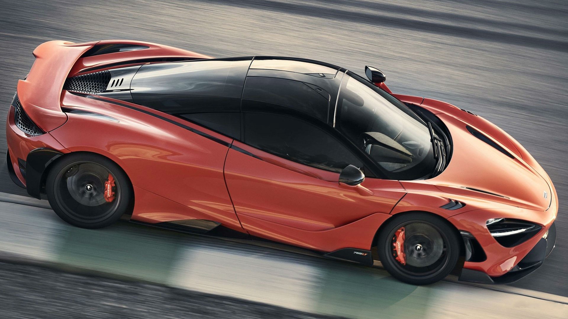 McLaren 765LT supercar driving on a track HD Wallpaper