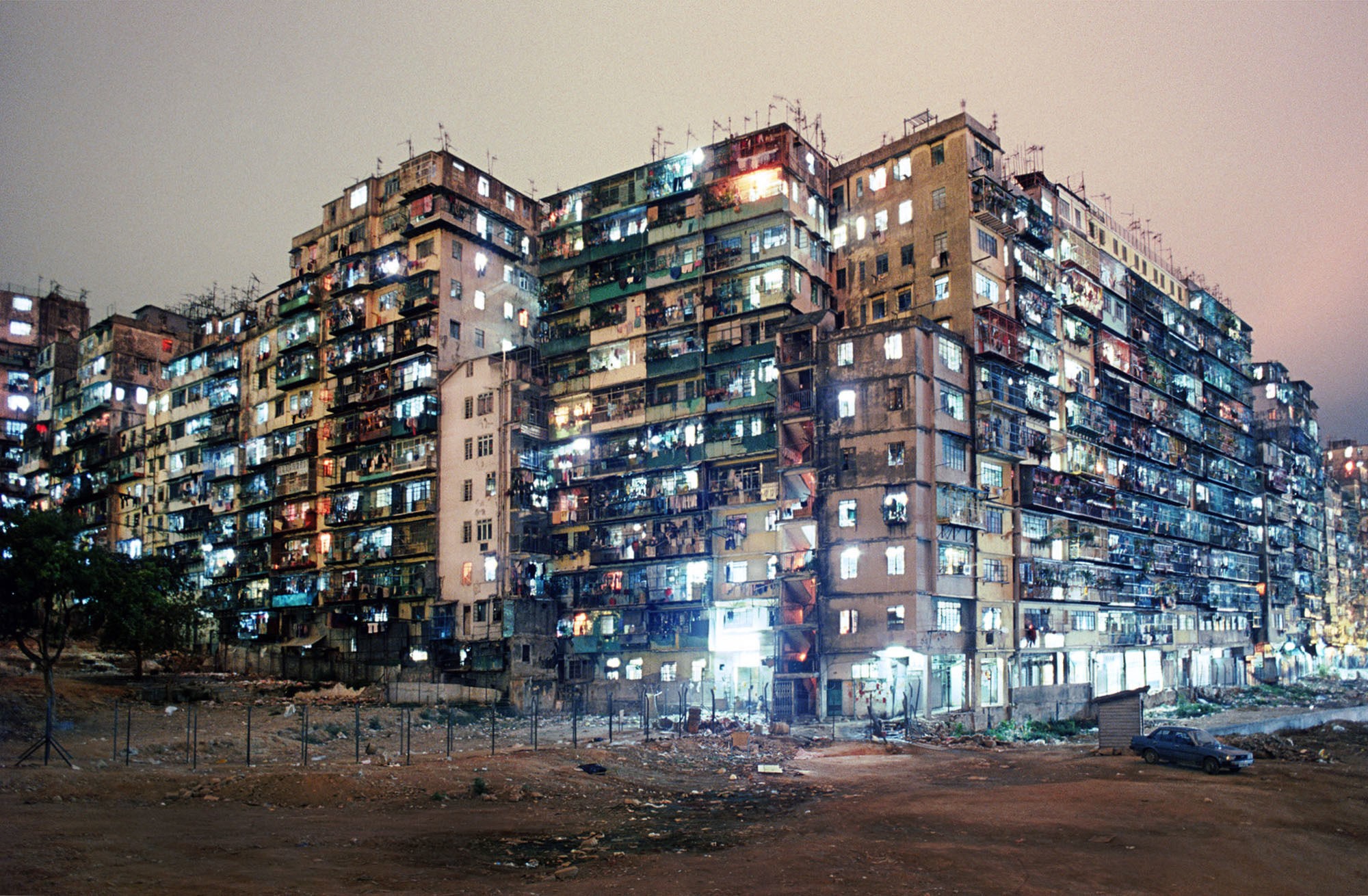 Kowloon Walled City apartment blocks at night HD Wallpaper
