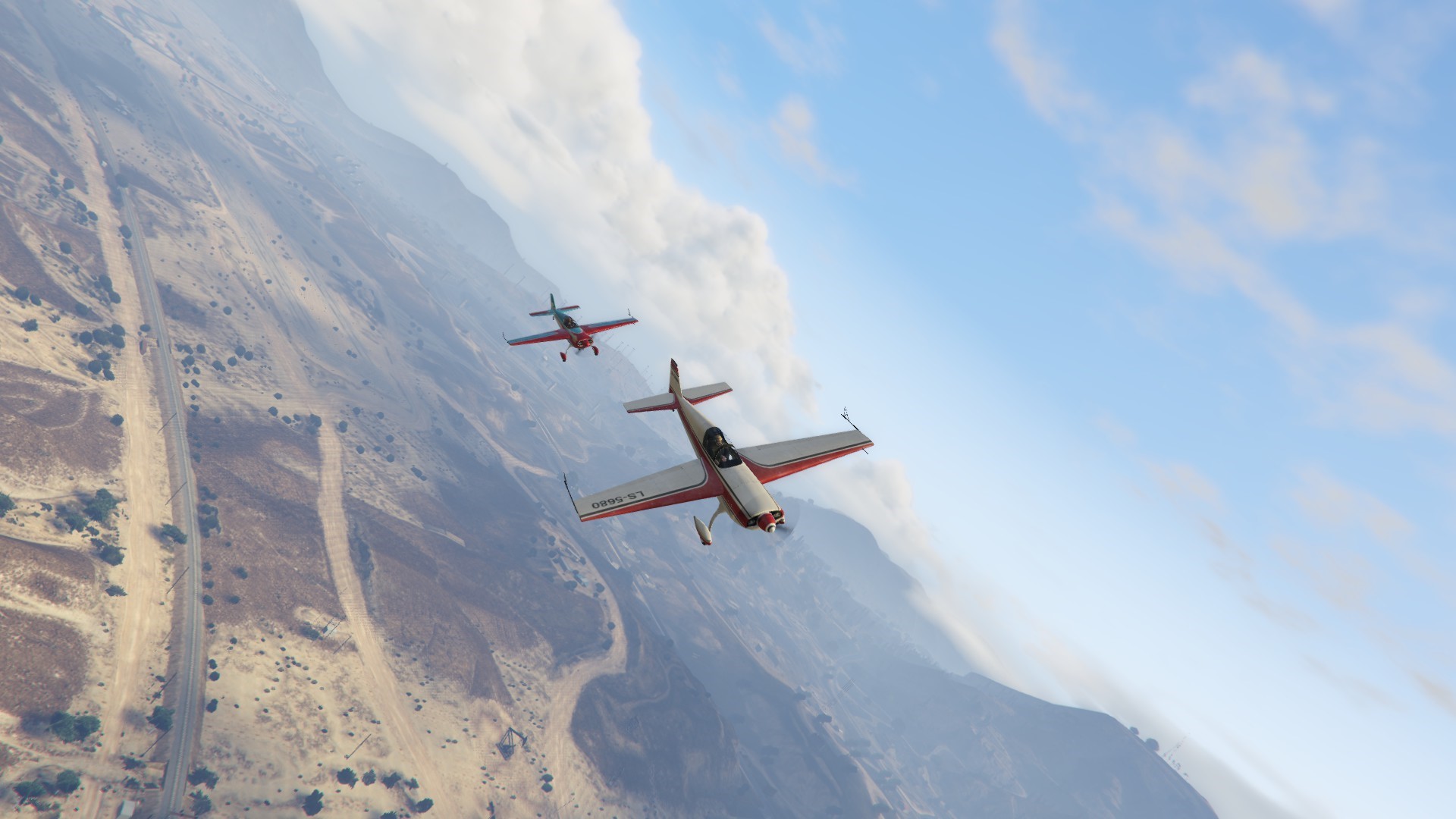 Two airplanes flying over a desert landscape in Grand Theft Auto V HD Wallpaper