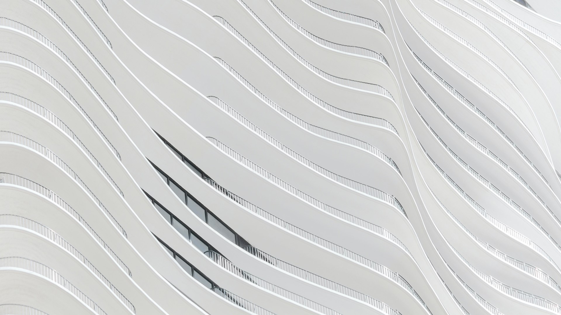 Abstract architectural detail of a modern building with balconies HD Wallpaper