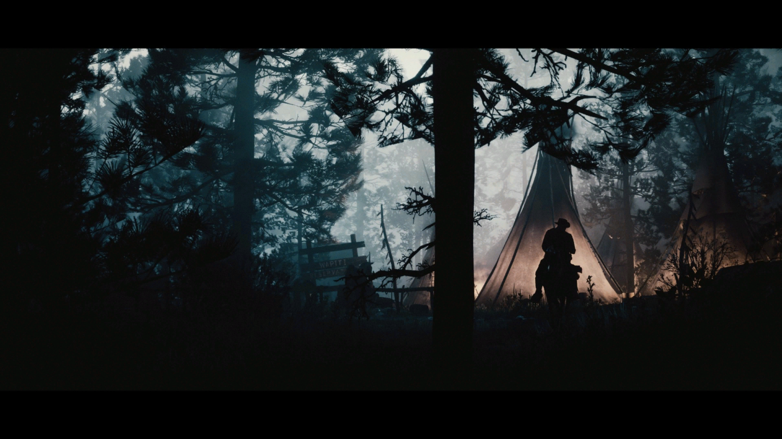Cowboy on horseback near tents in a forest HD Wallpaper