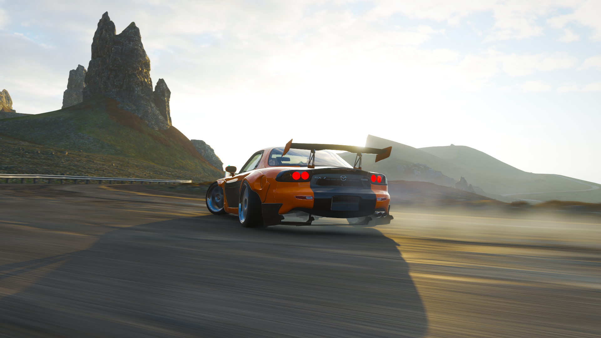 Orange Mazda RX-7 FD drifting on a road at sunset HD Wallpaper