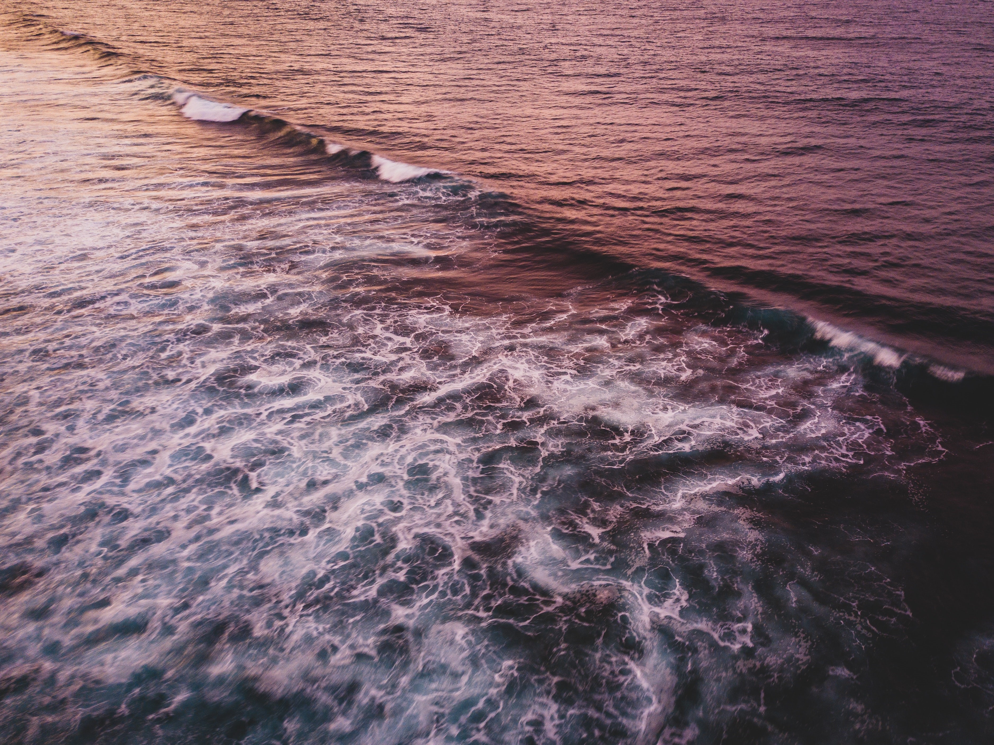 Ocean waves at sunset HD Wallpaper