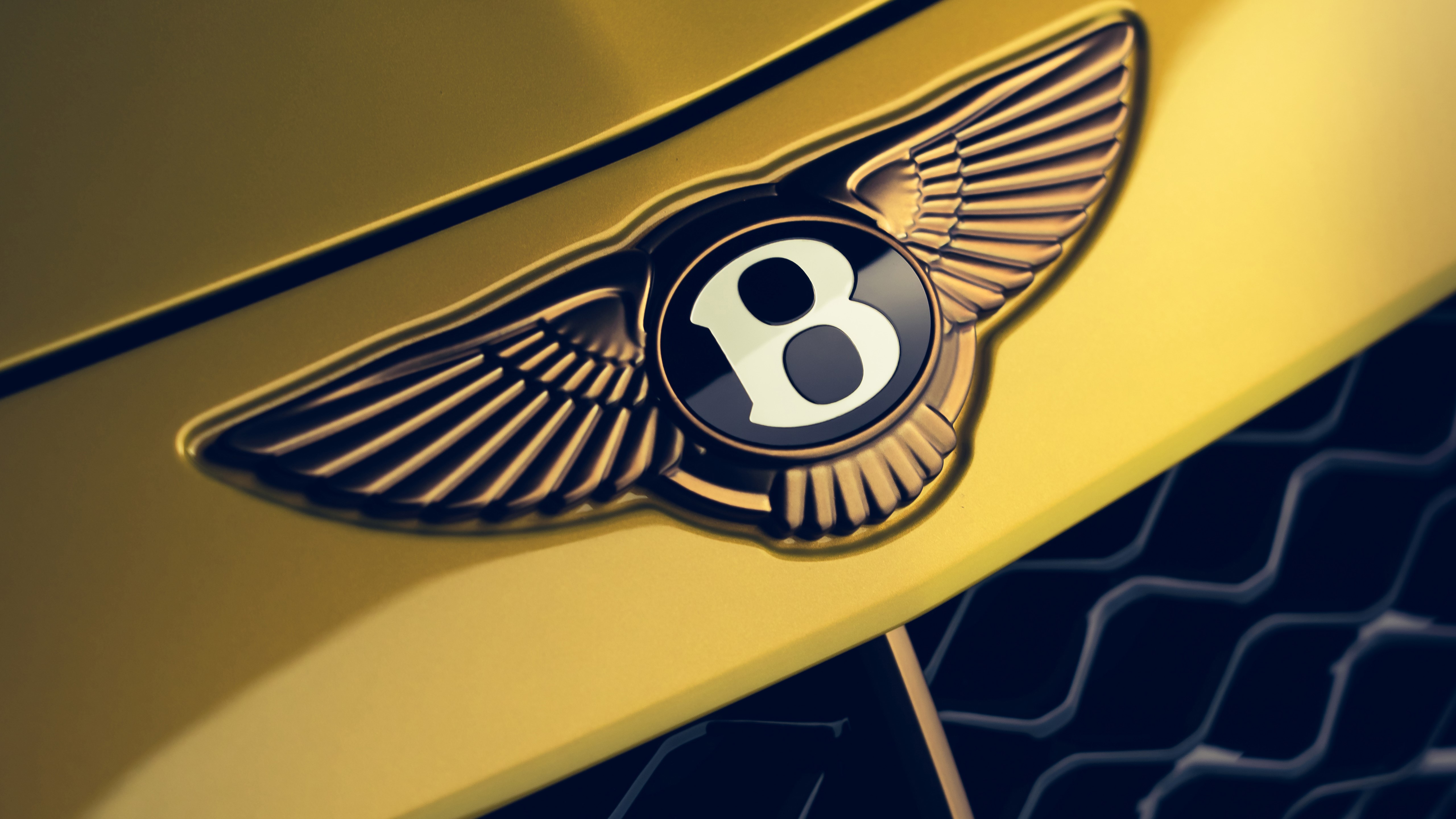Bentley Wings Logo on Yellow Car HD Wallpaper