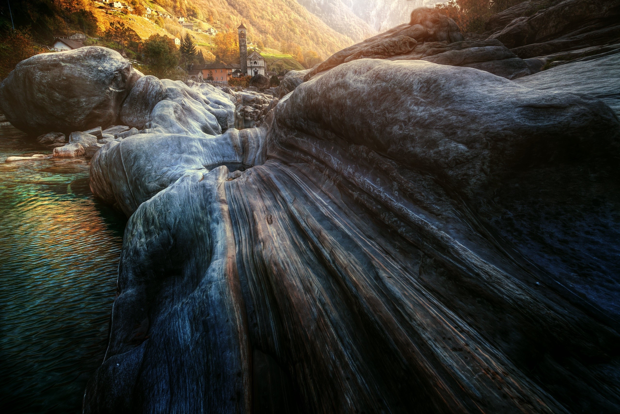 River flowing through rocks in Switzerland HD Wallpaper