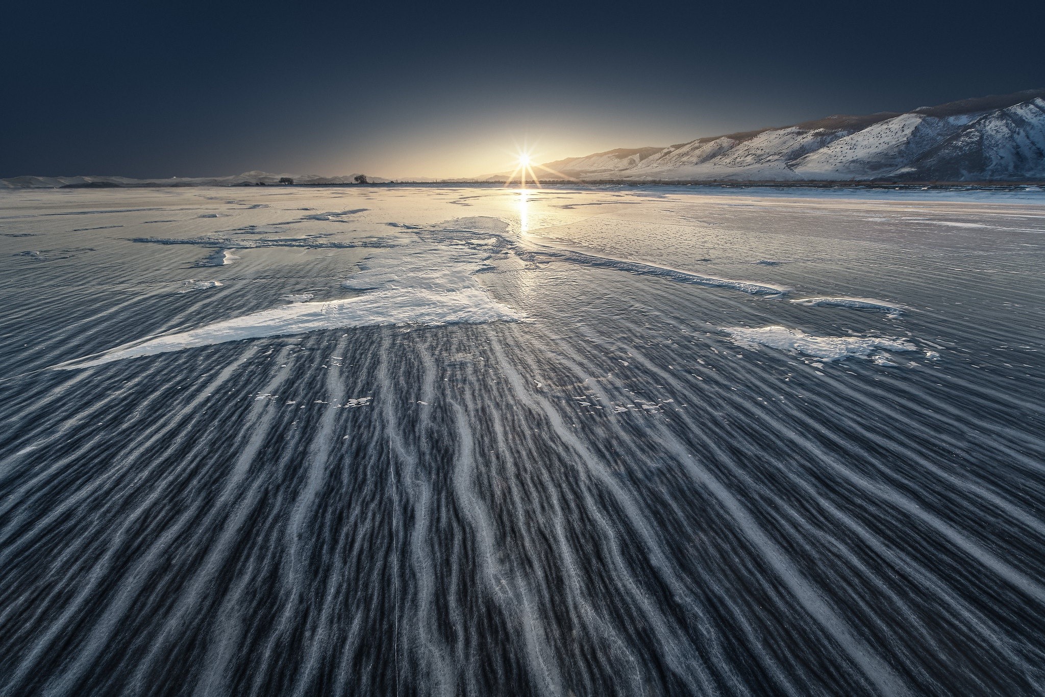 Winter landscape with sun over icy plains and mountains HD Wallpaper