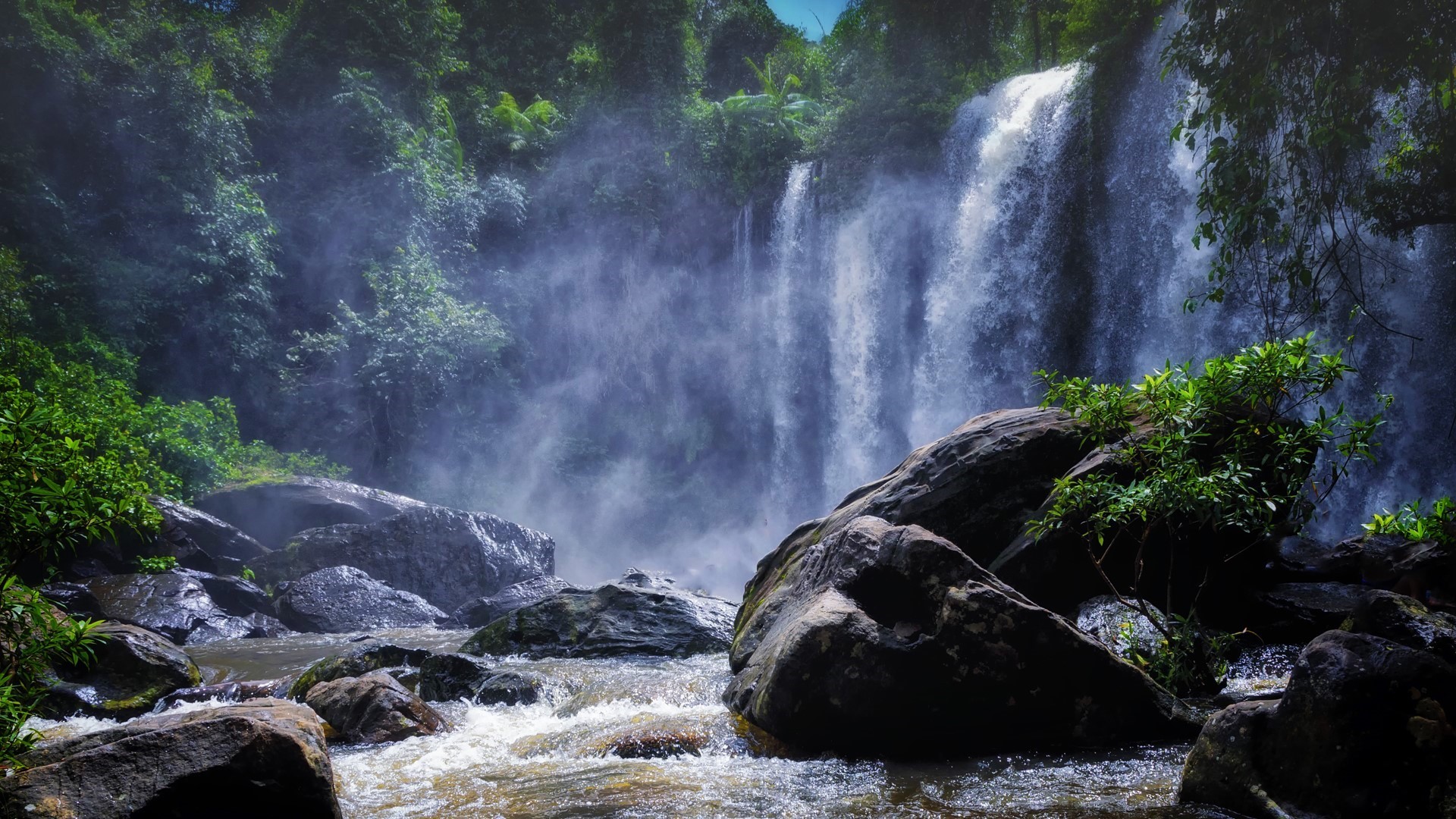 Waterfall in Cambodia with Mist and Rocks HD Wallpaper