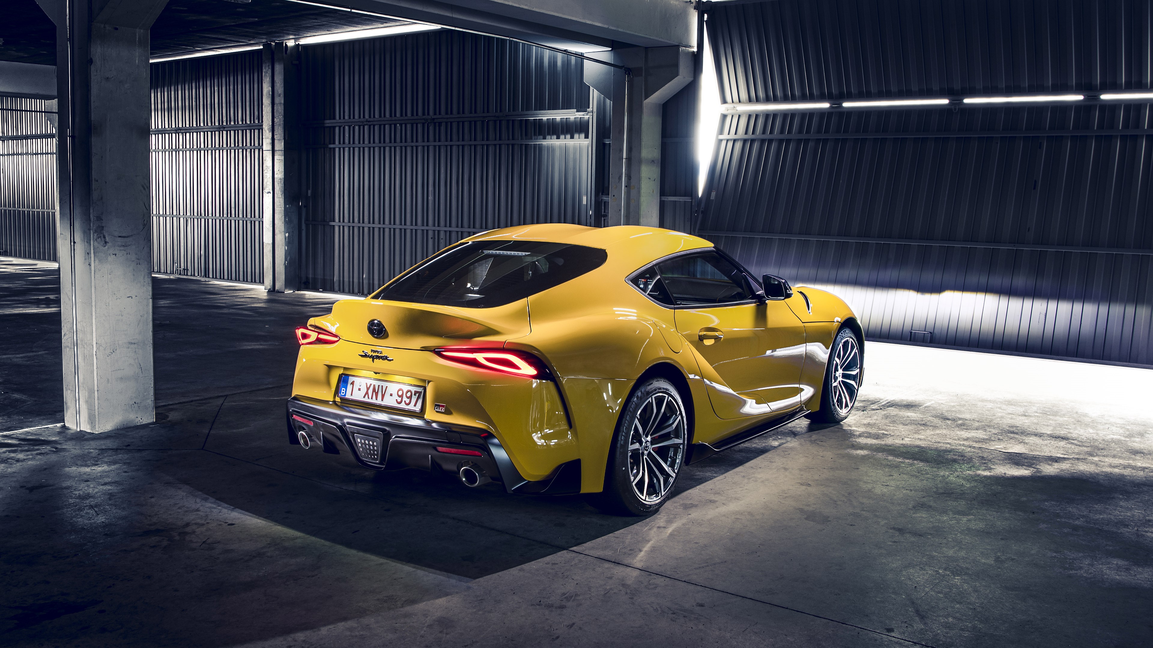 Yellow Toyota Supra parked in a garage HD Wallpaper