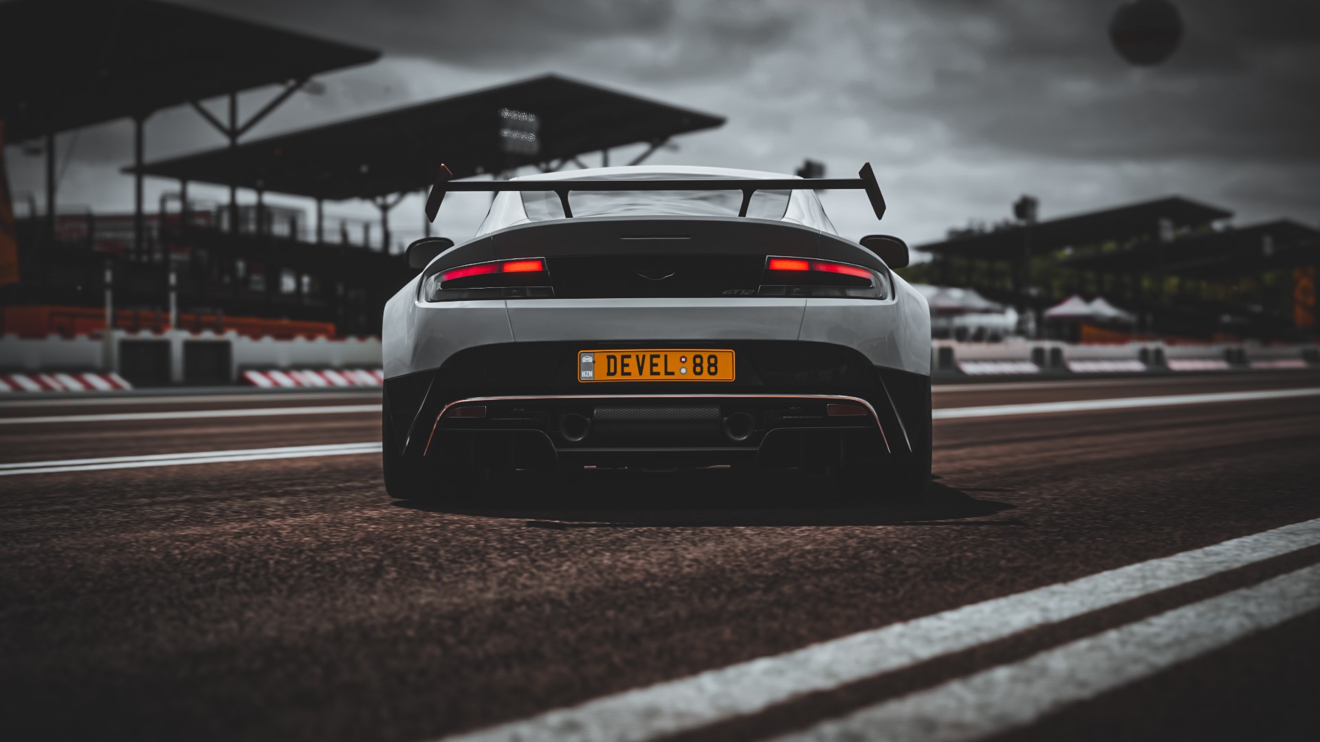 Aston Martin Vantage GT12 on a race track HD Wallpaper