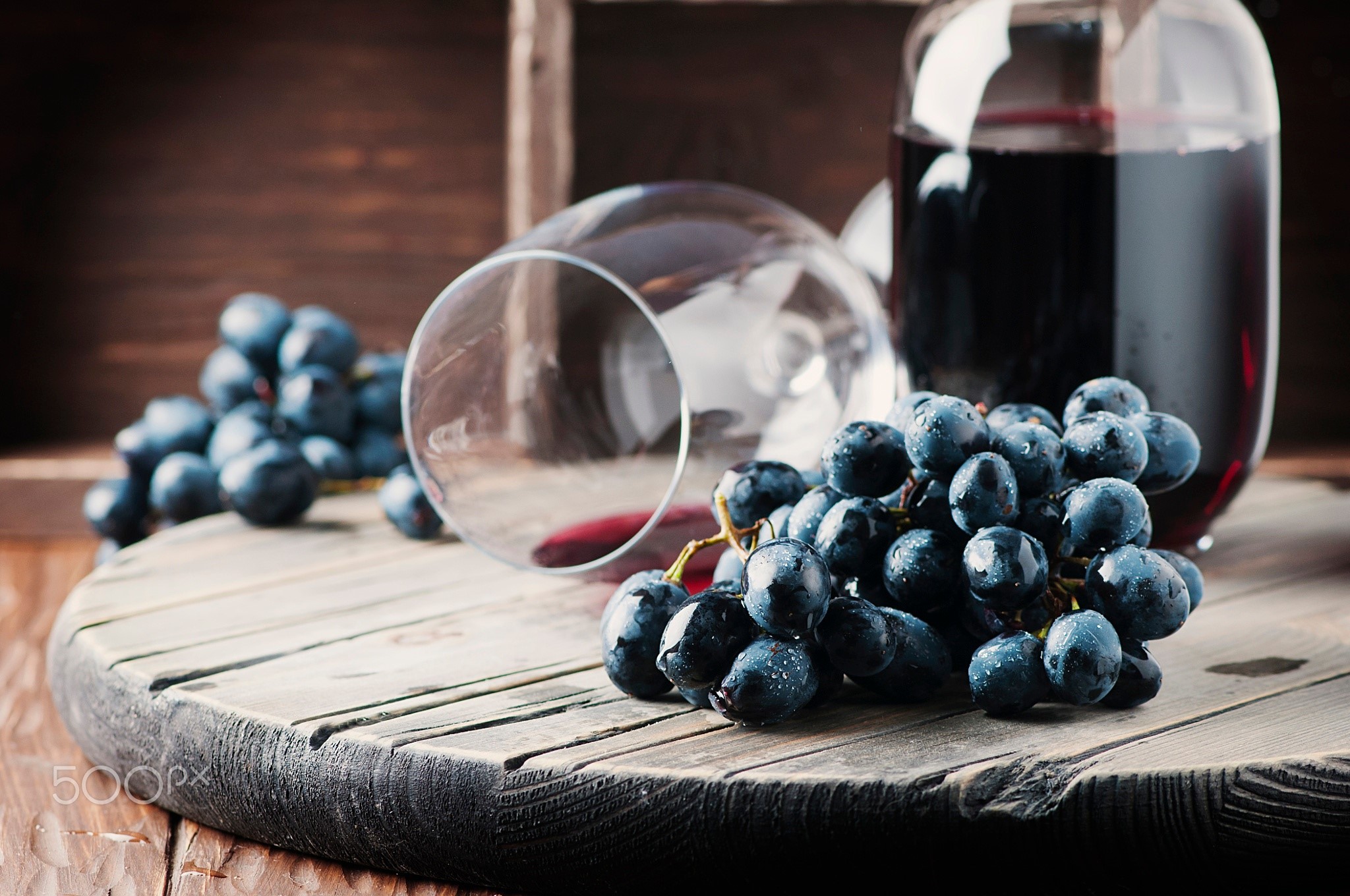 Grapes and red wine on a wooden surface HD Wallpaper