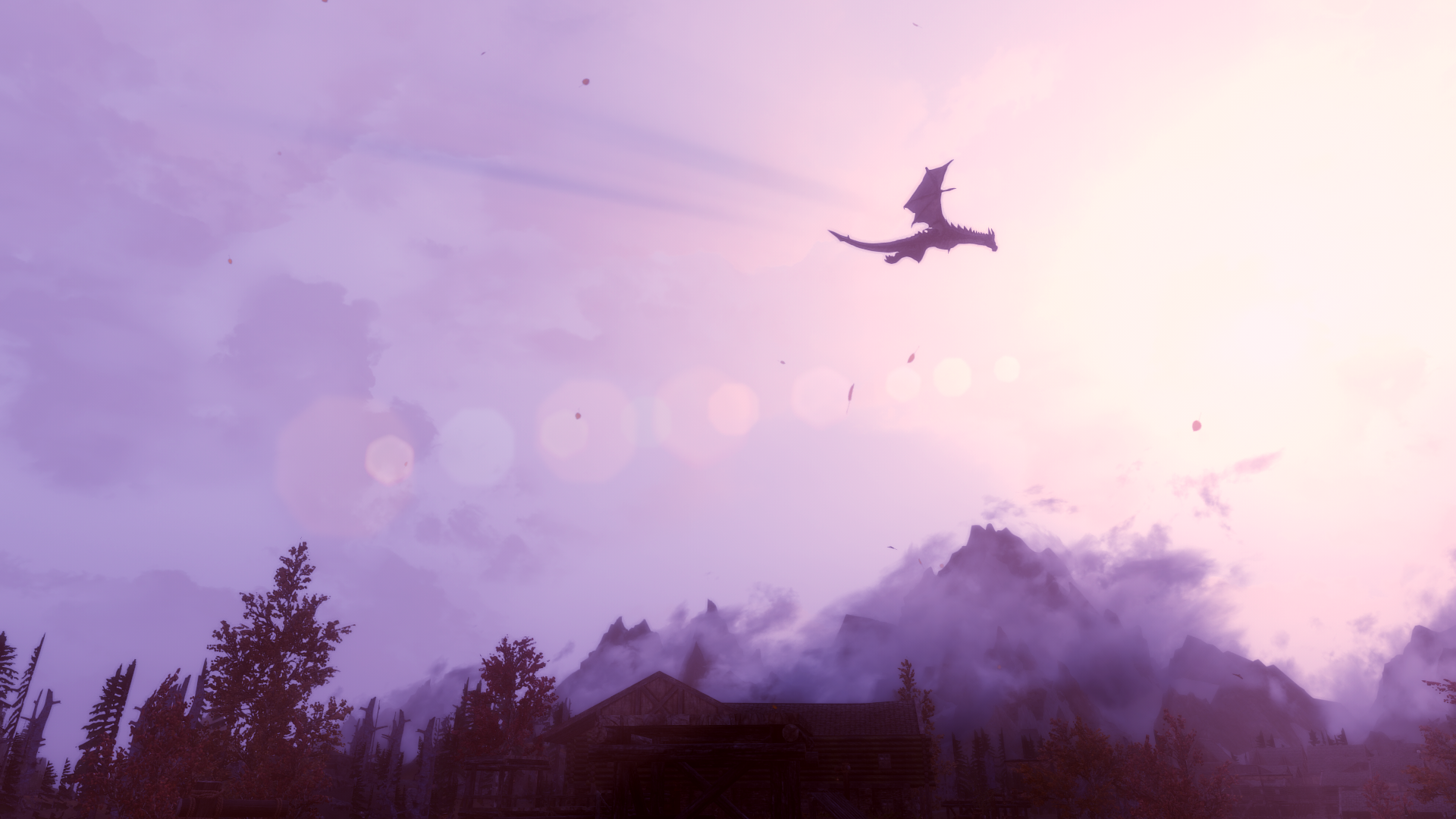 Dragon flying over mountains and a village in Skyrim HD Wallpaper