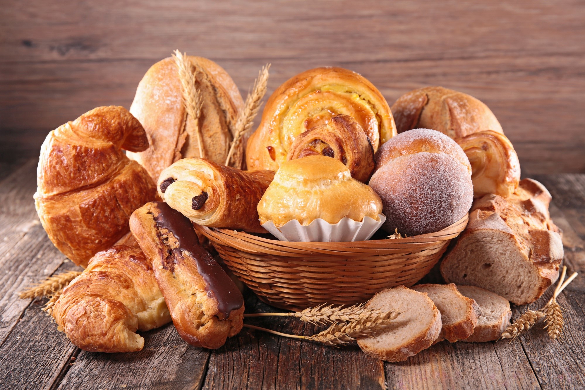 Assortment of baked goods on a wooden surface HD Wallpaper