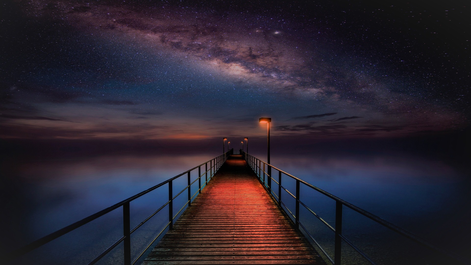 Wooden walkway under the Milky Way at night HD Wallpaper