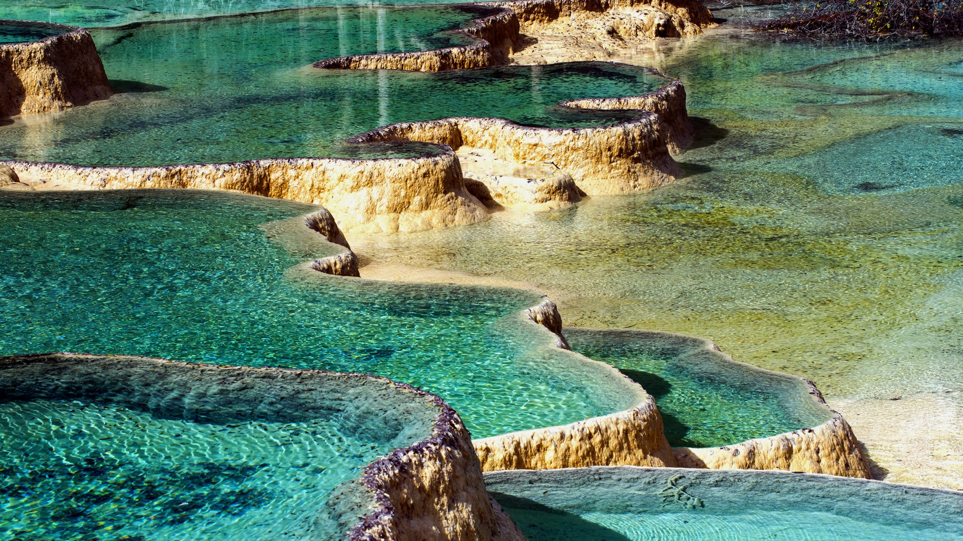 Terraced pools of clear turquoise water in Huanglong National Park, China HD Wallpaper