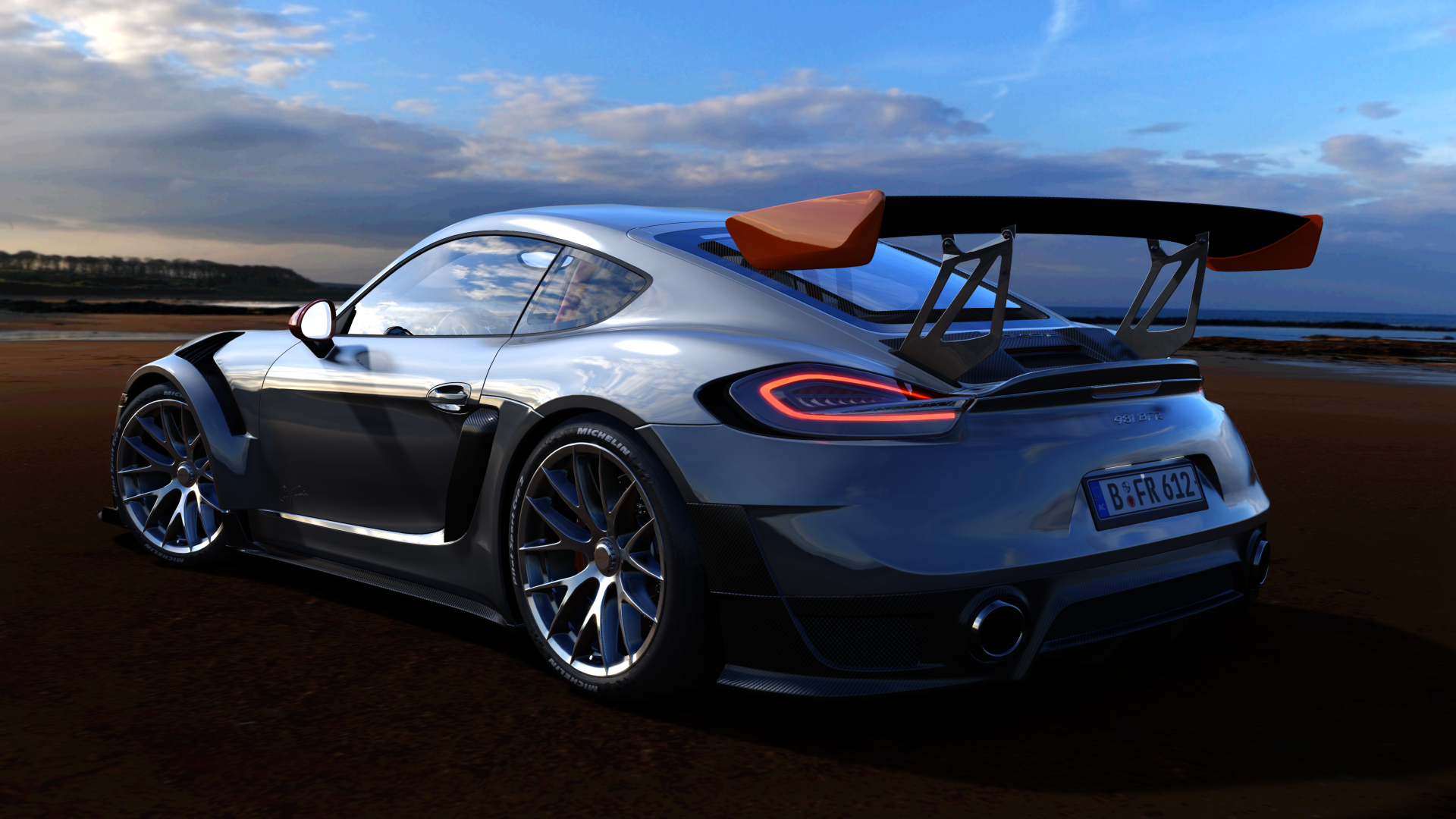 Porsche Cayman GT4 with large rear wing on beach HD Wallpaper