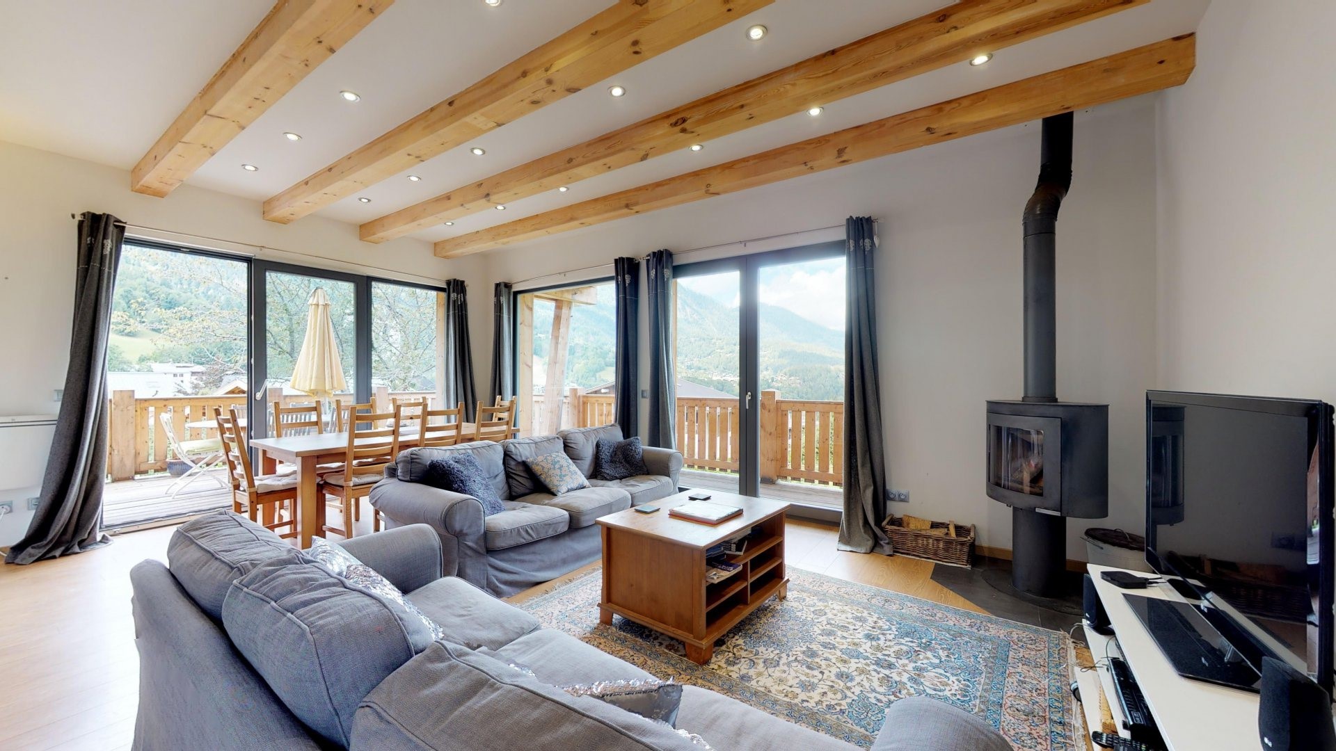 Living room with fireplace and mountain view HD Wallpaper