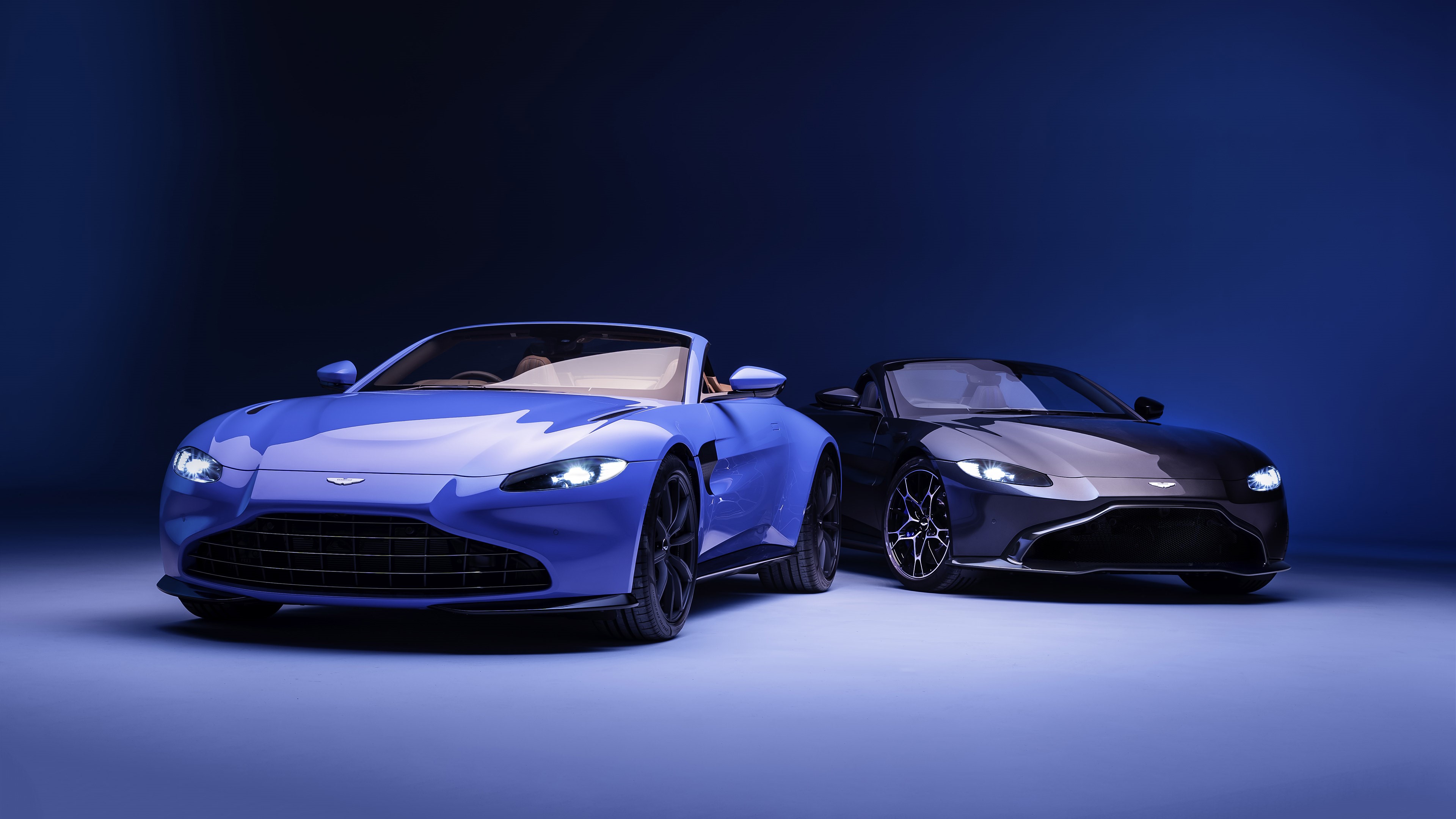 Aston Martin Vantage Convertibles on a Blue Background HD Wallpaper