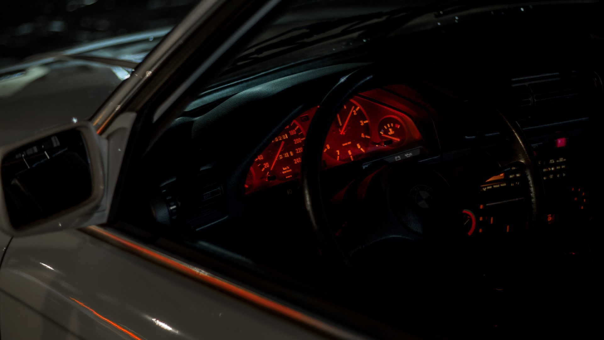 BMW E30 interior with red illuminated dashboard HD Wallpaper