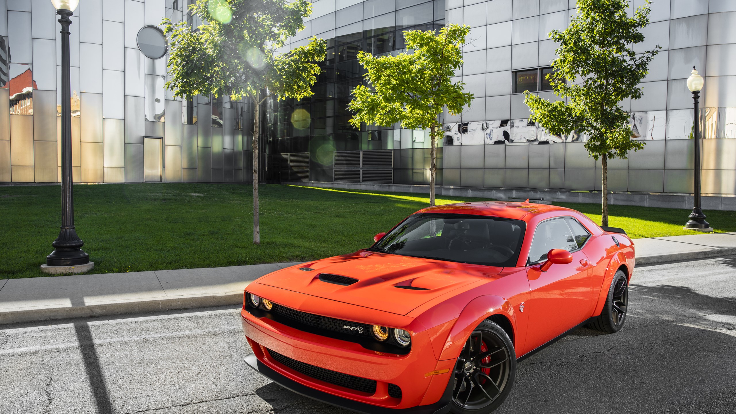 Orange Dodge Challenger SRT Hellcat parked on street HD Wallpaper