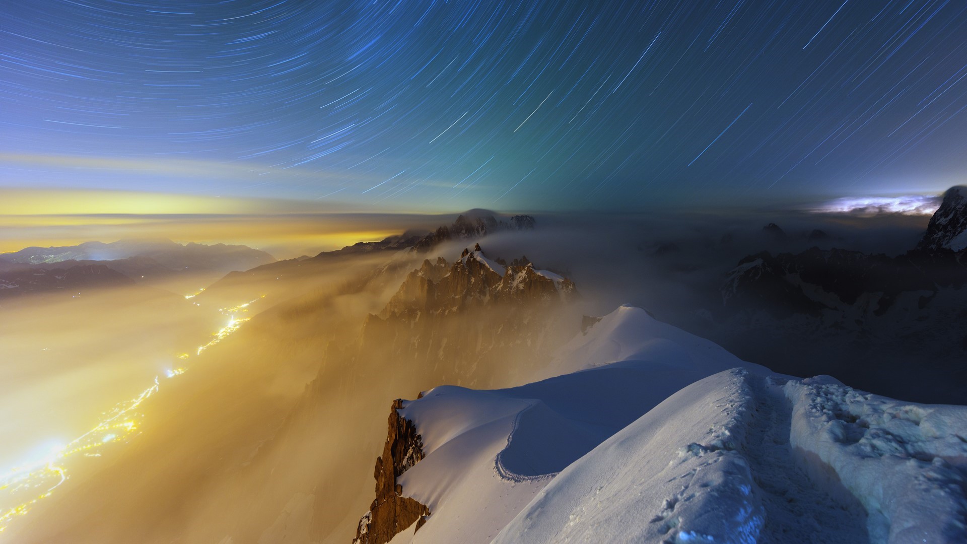 Star trails over Aiguille du Midi valley at night HD Wallpaper
