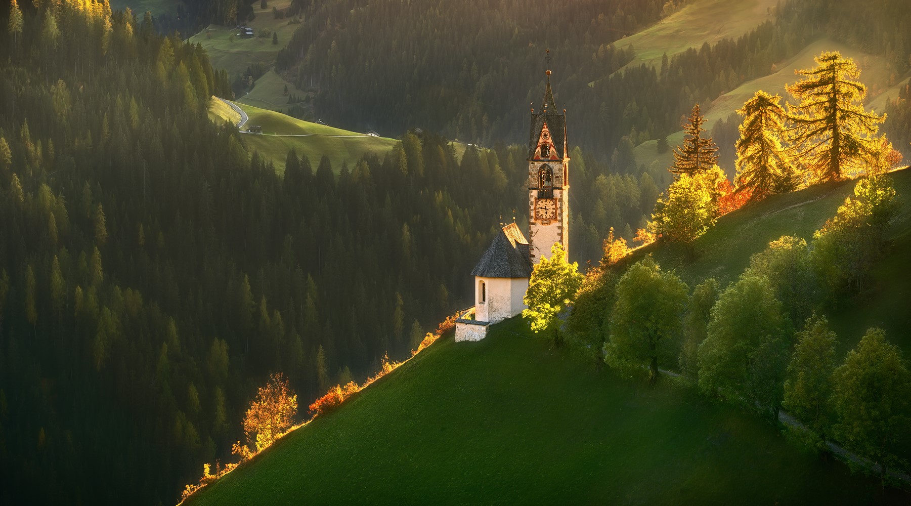 Church on a hill in a forest landscape at sunset HD Wallpaper