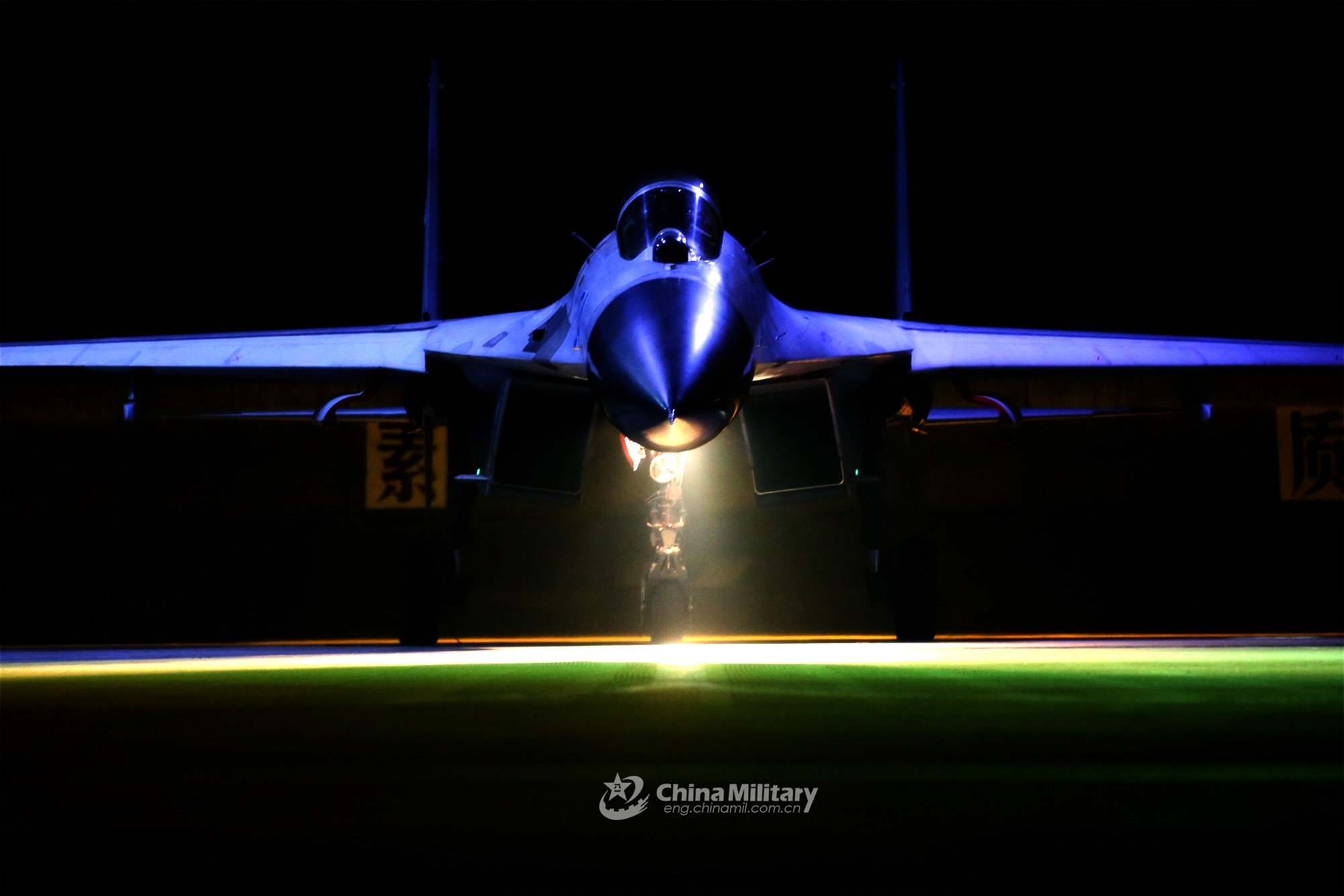 Frontal view of a Chinese military jet fighter on runway HD Wallpaper