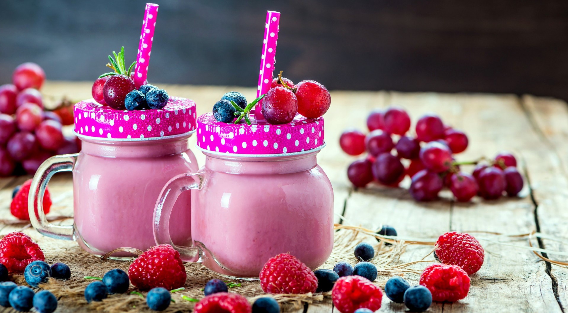 Pink berry smoothies in mason jars with fresh fruit HD Wallpaper