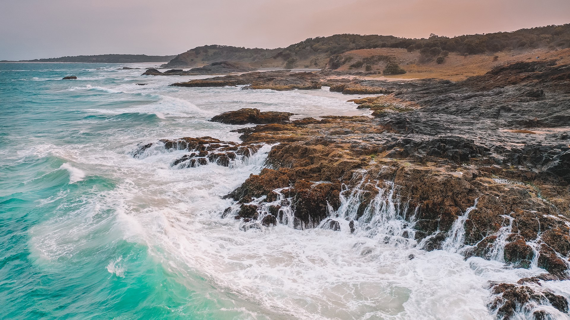 Ocean waves crashing on rocky shore landscape HD Wallpaper