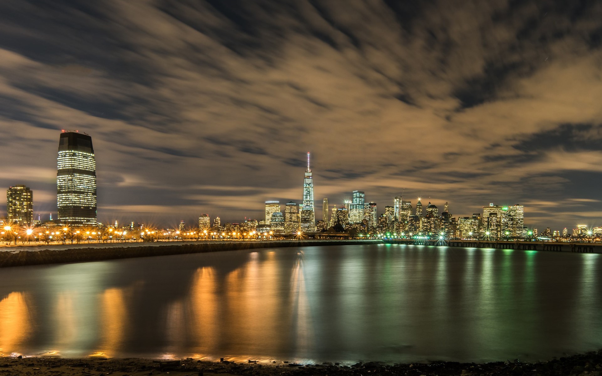 New York City skyline at night across the water HD Wallpaper