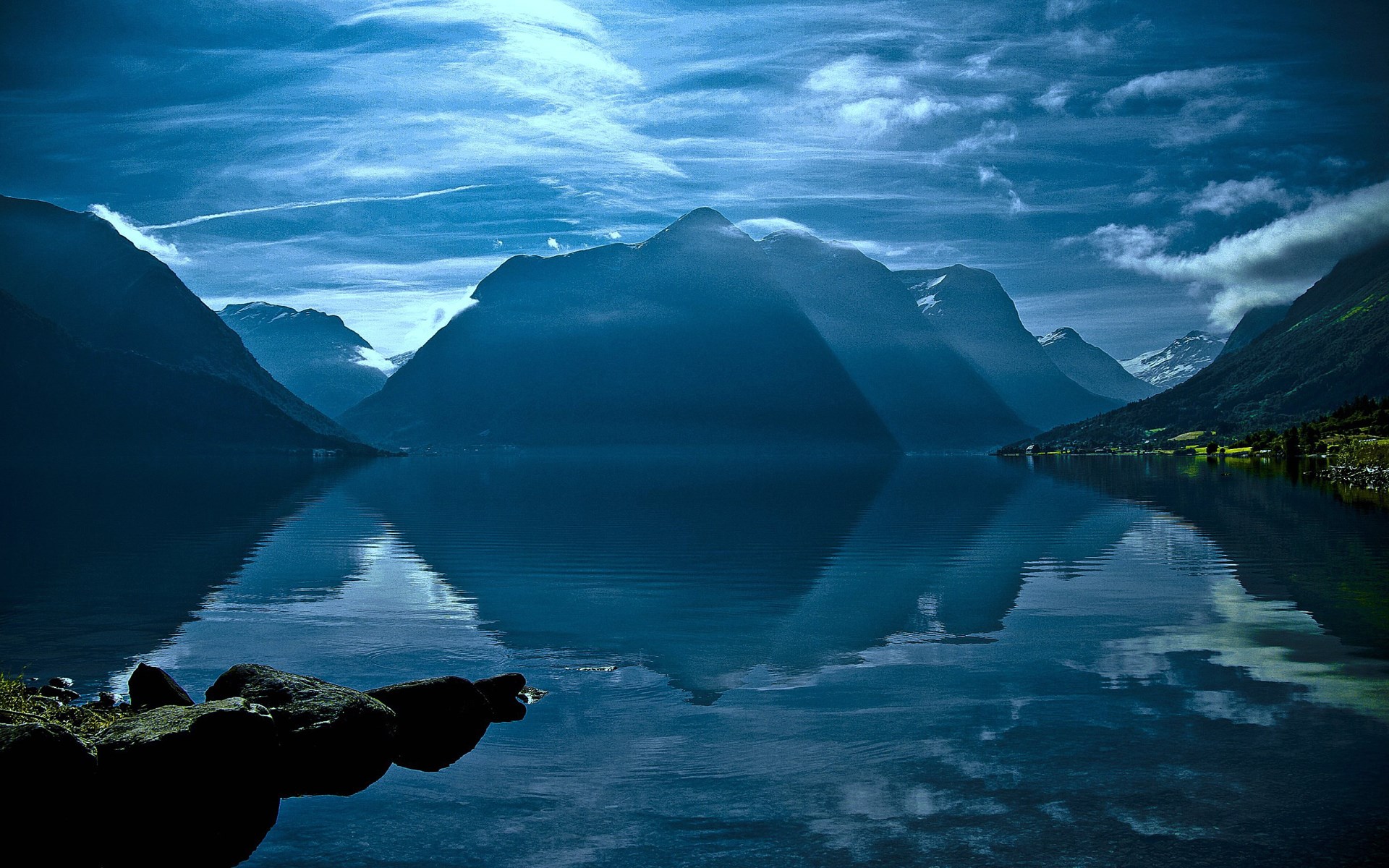 Mountain lake with reflections and dramatic sky HD Wallpaper
