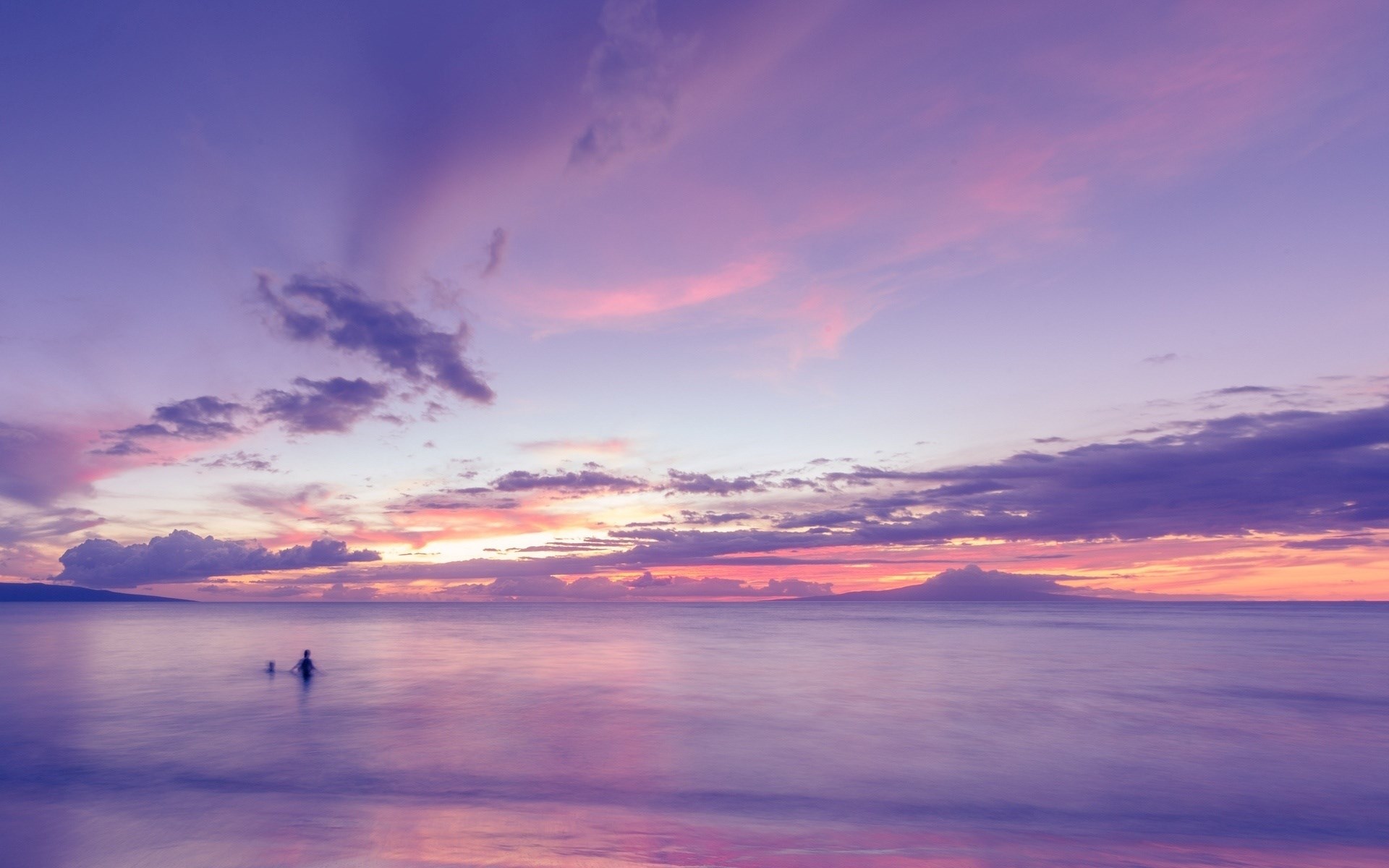 People swimming in the ocean at sunset HD Wallpaper