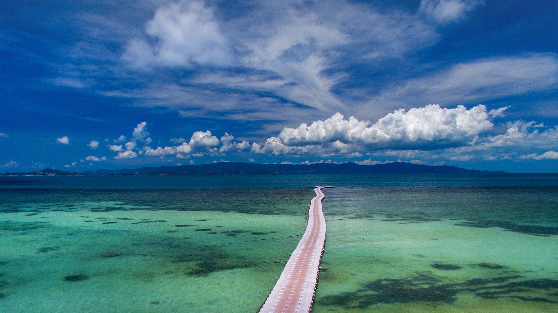 Floating bridge over turquoise water in Thailand HD Wallpaper