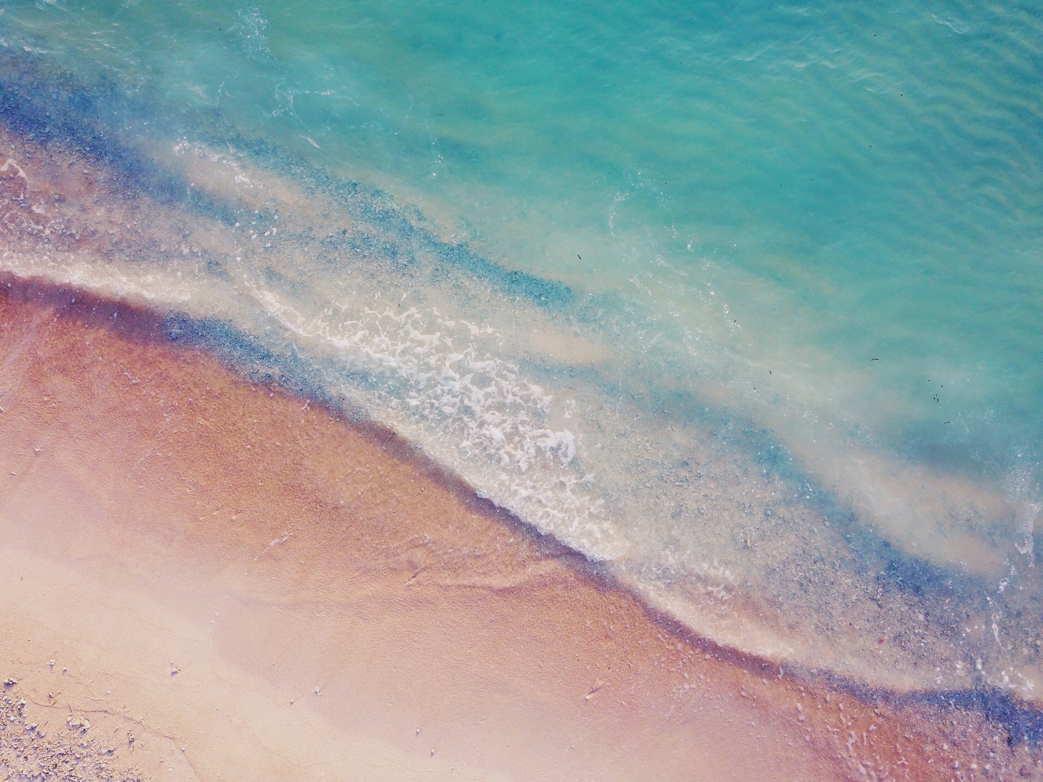 Aerial view of a beach with turquoise water HD Wallpaper