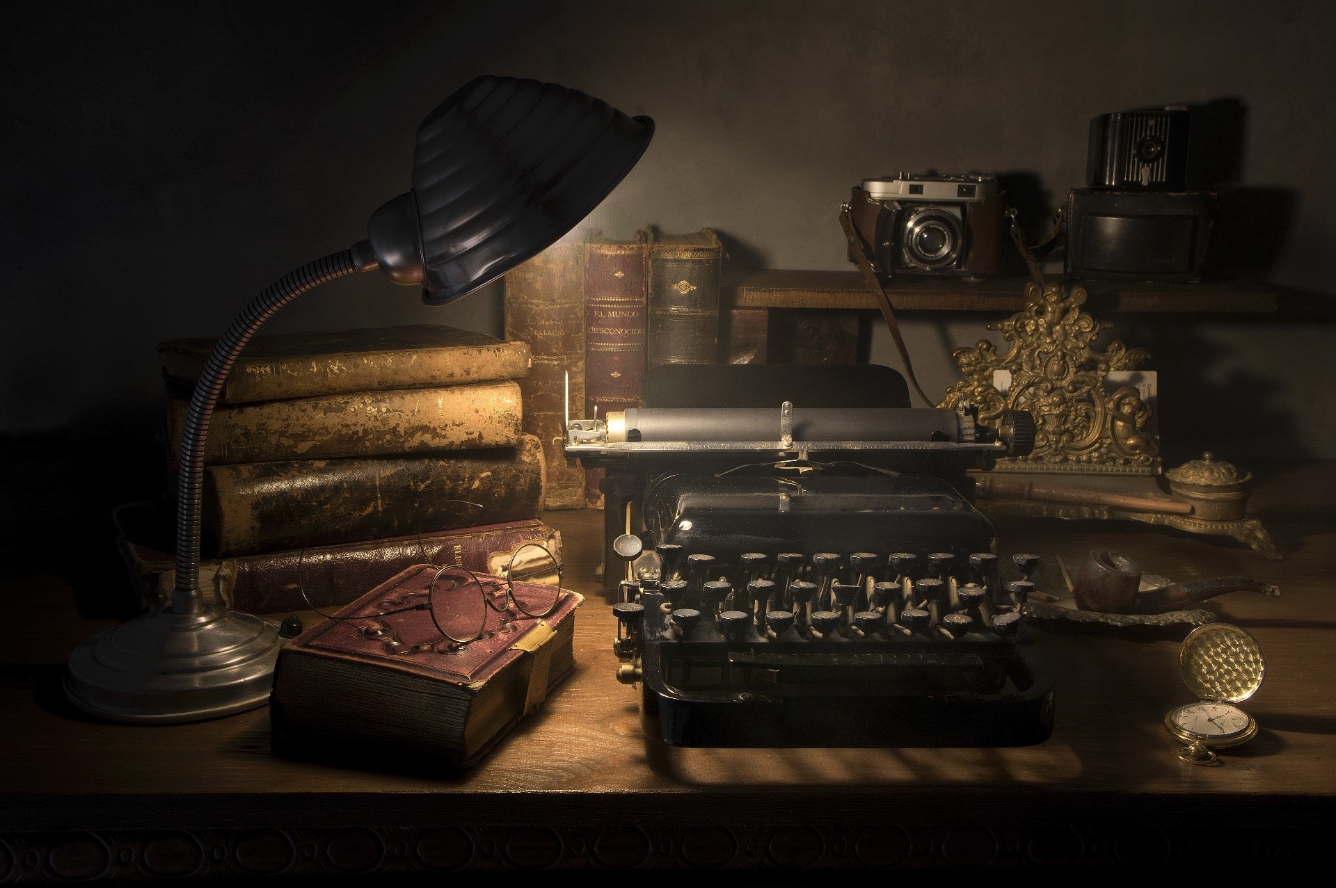Vintage desk with typewriter, camera, and books HD Wallpaper