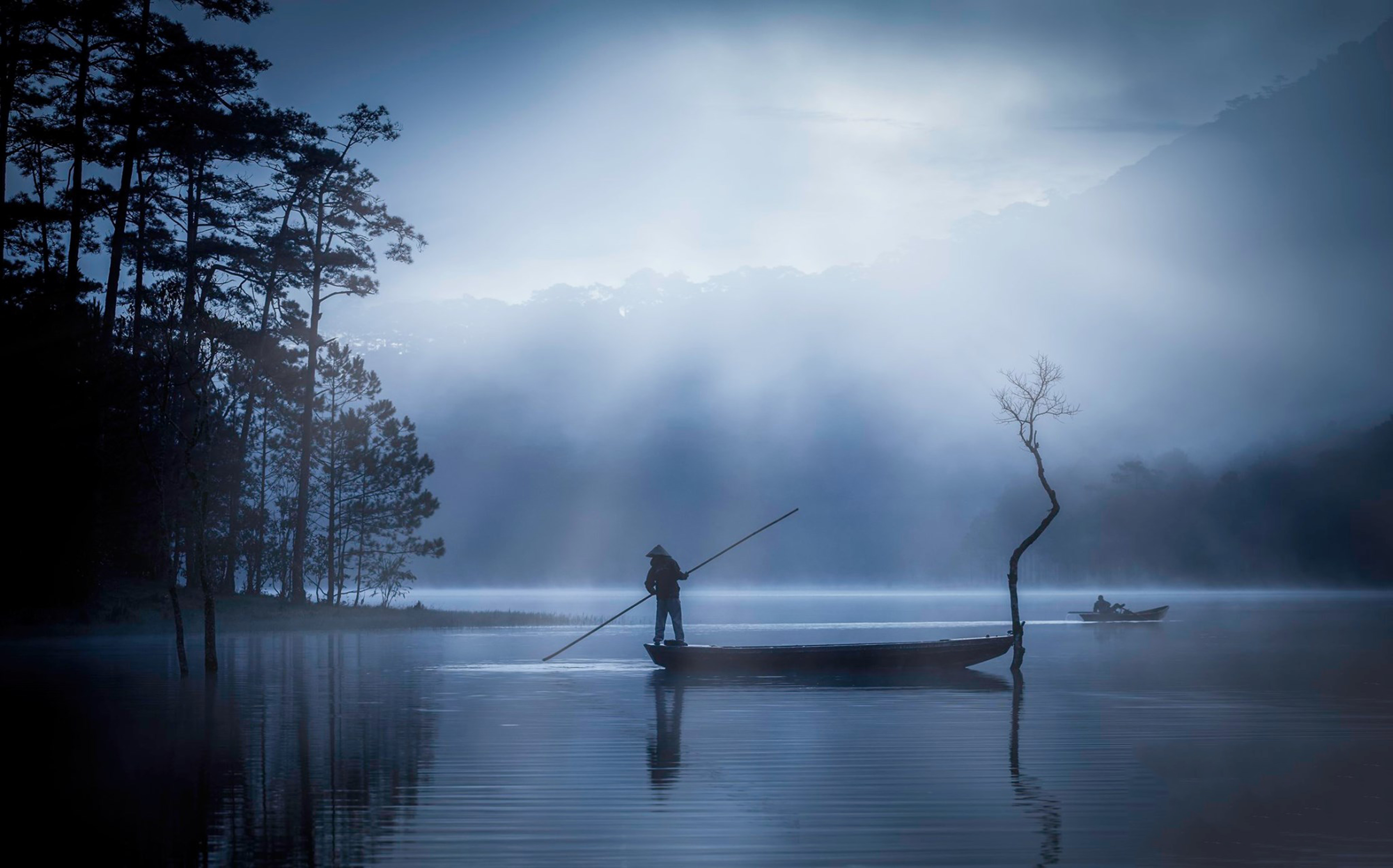 Man in boat on misty lake at dusk HD Wallpaper