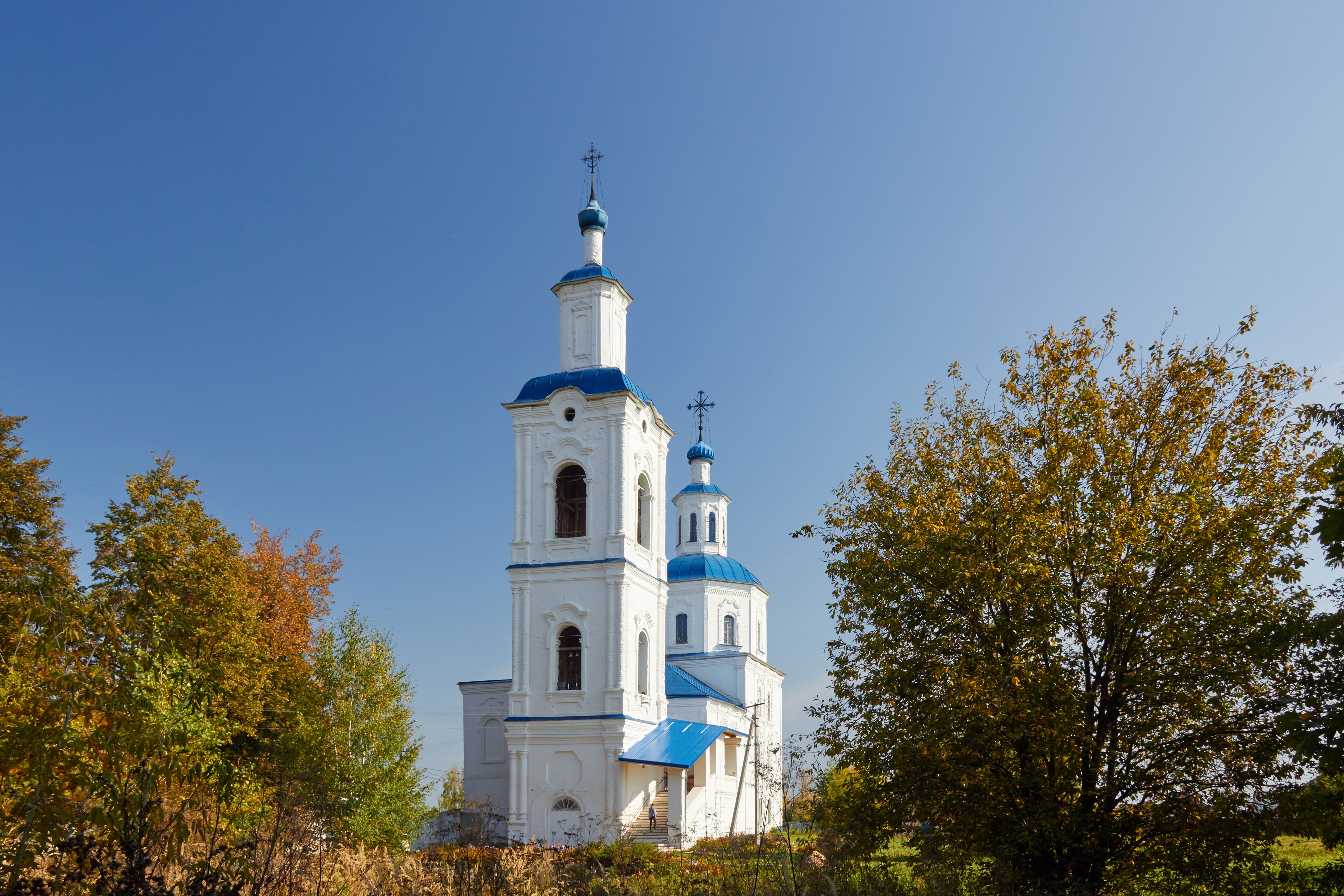 White Orthodox church with blue domes and bell tower HD Wallpaper