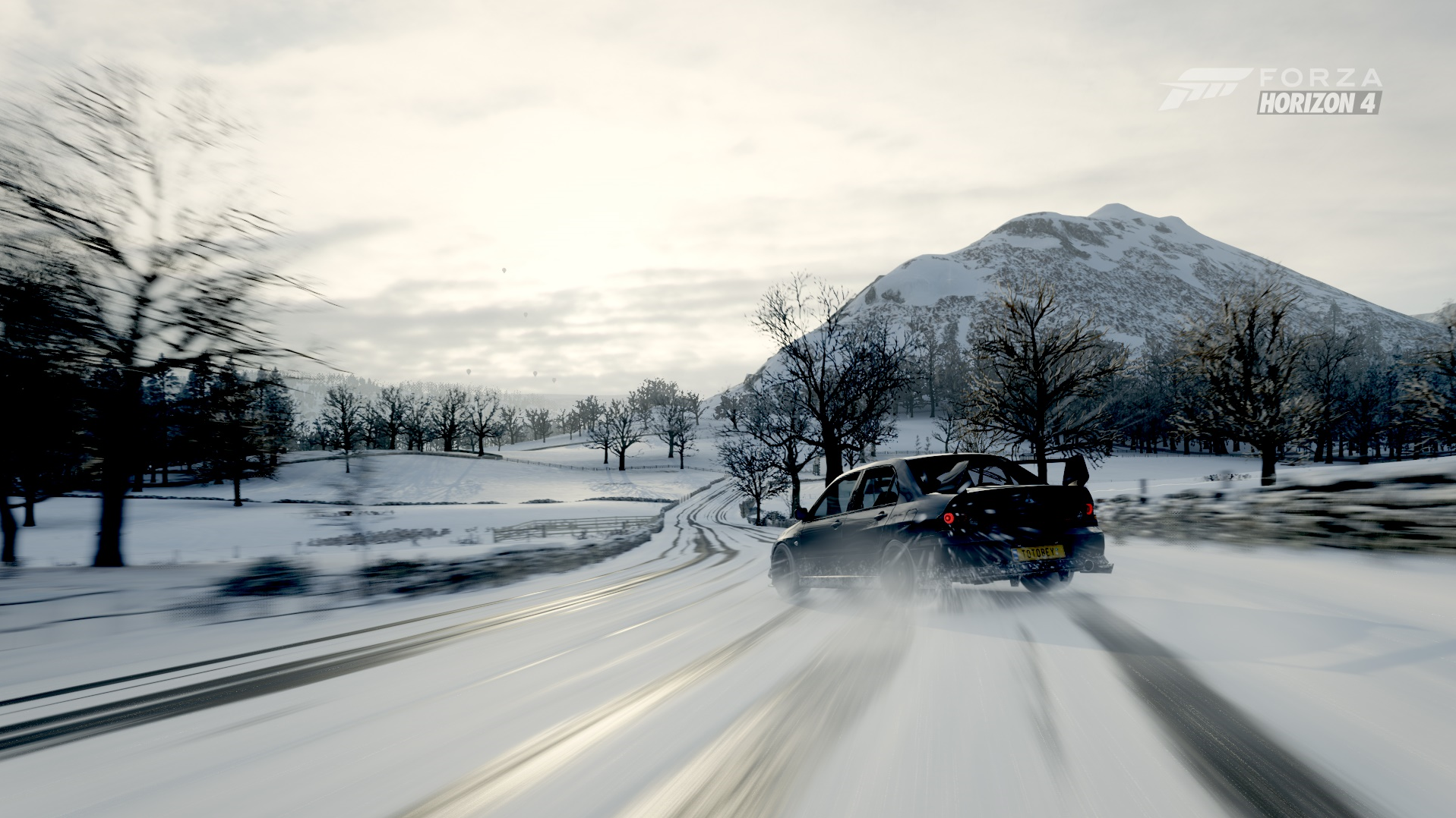 Mitsubishi Lancer Evolution VIII drifting in snow in Forza Horizon 4 HD Wallpaper