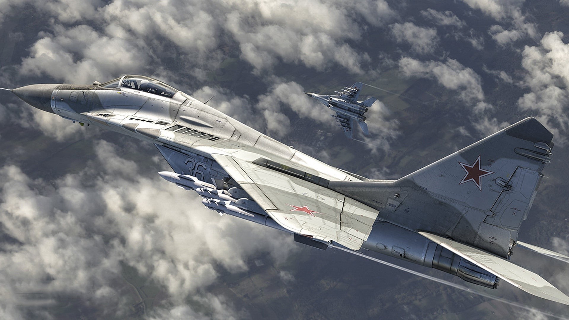 Two Russian MiG-29 fighter jets flying through clouds HD Wallpaper