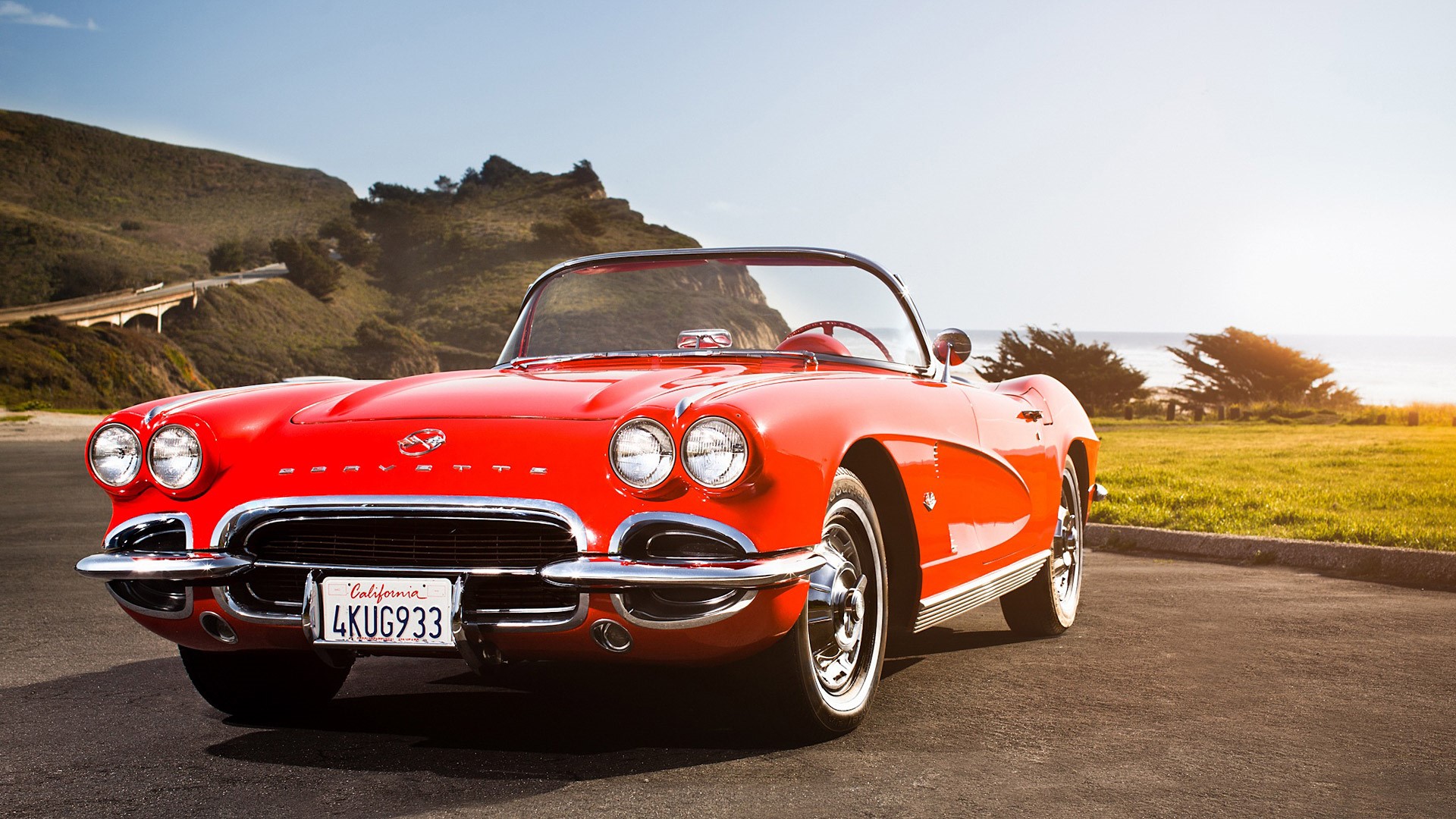 Red Chevrolet Corvette C1 Convertible on Coastal Road HD Wallpaper