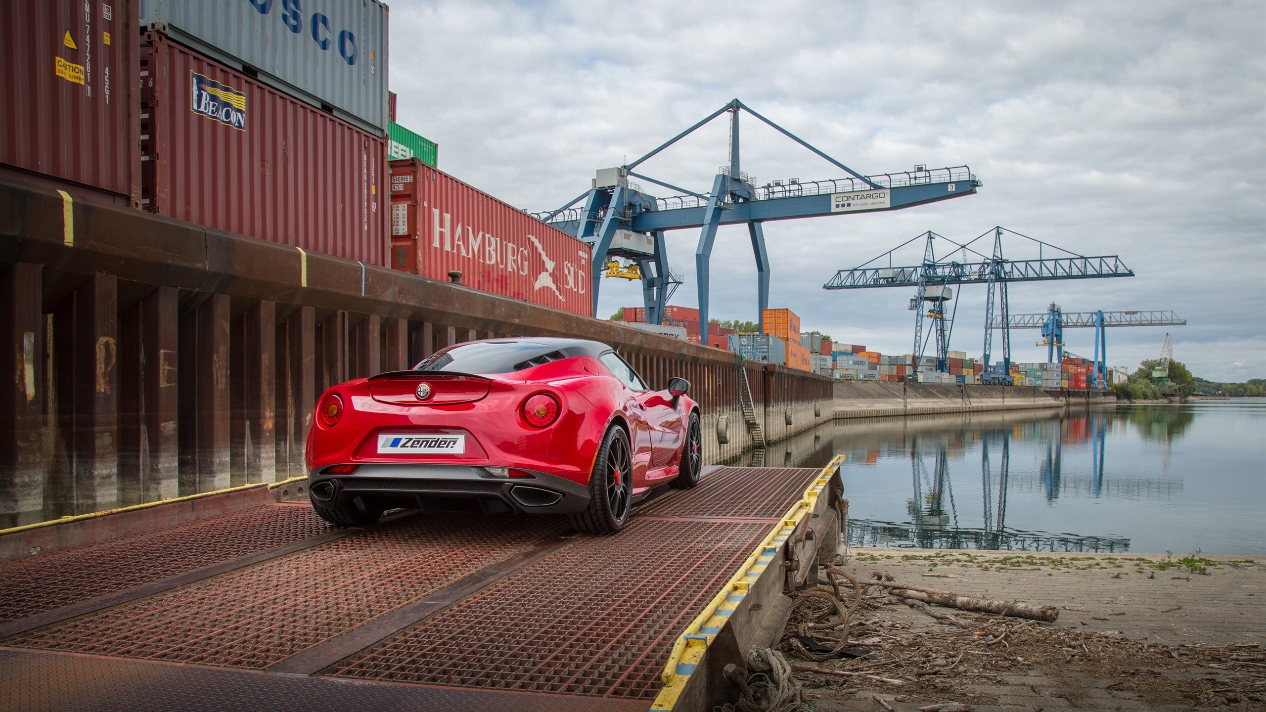Red Alfa Romeo 4C at a Shipping Port HD Wallpaper