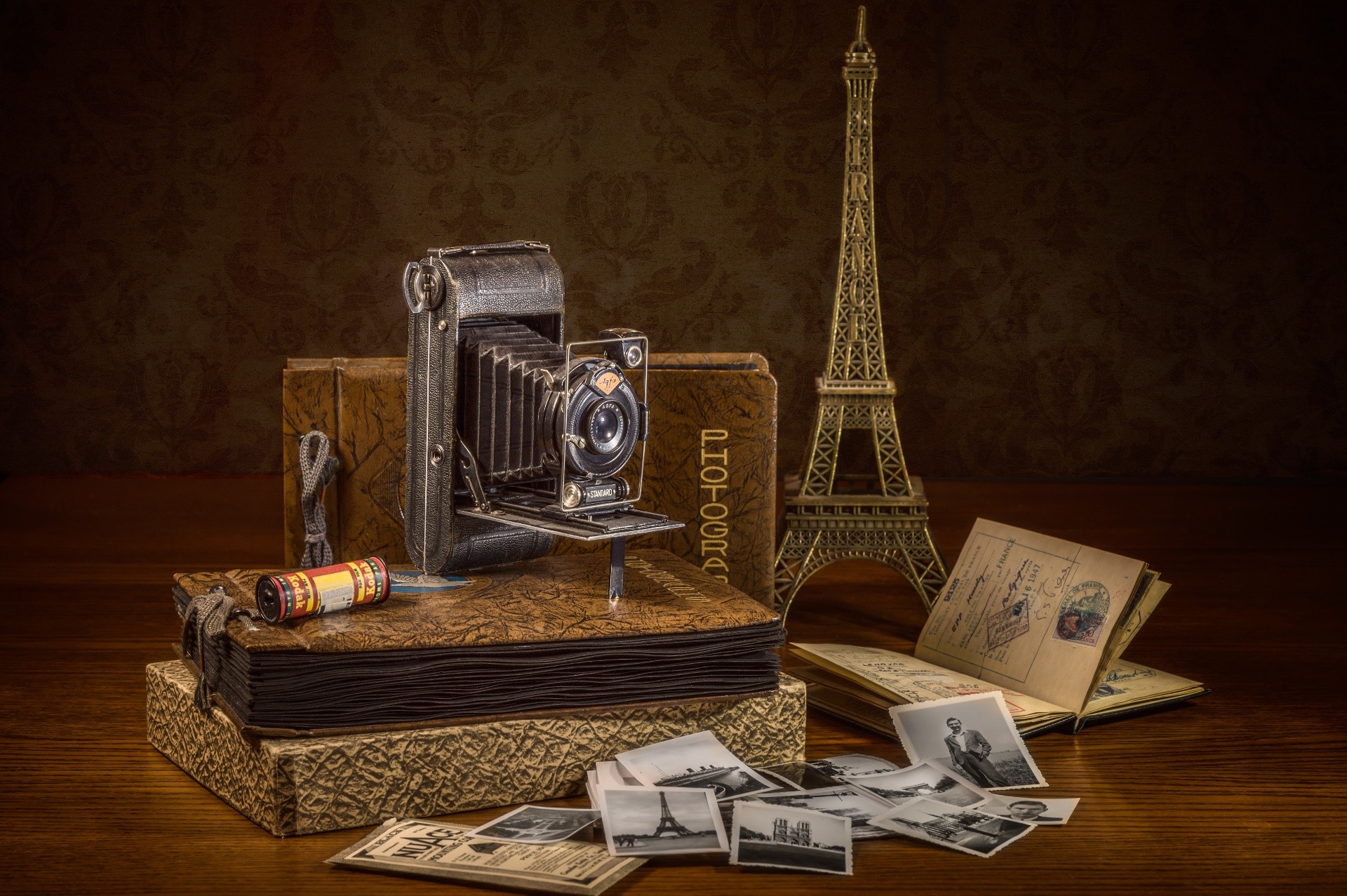 Vintage camera and Eiffel Tower souvenir HD Wallpaper