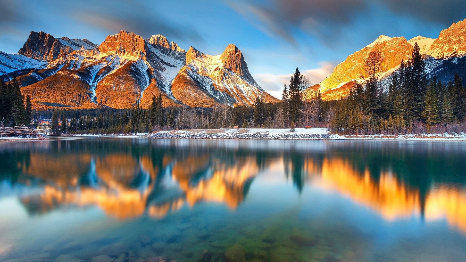 Mountains reflecting in a lake at sunrise HD Wallpaper
