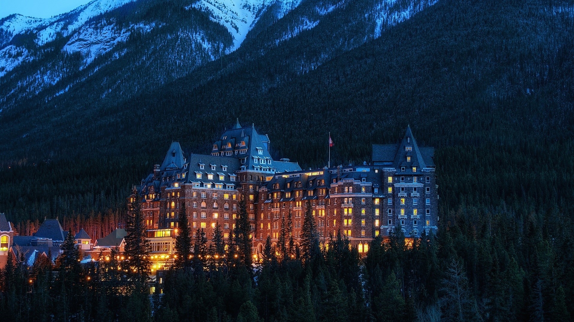 Fairmont Banff Springs Hotel in Banff National Park at dusk HD Wallpaper